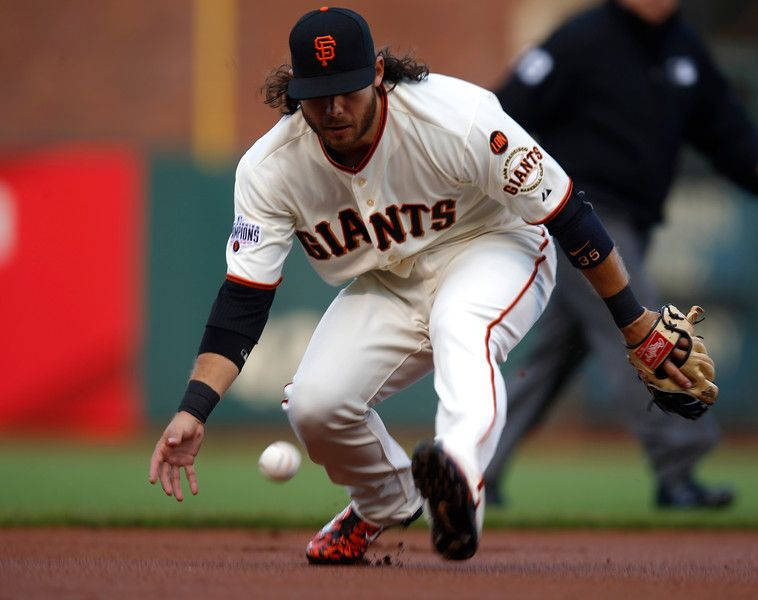 Brandon Crawford In Action On The Field Background