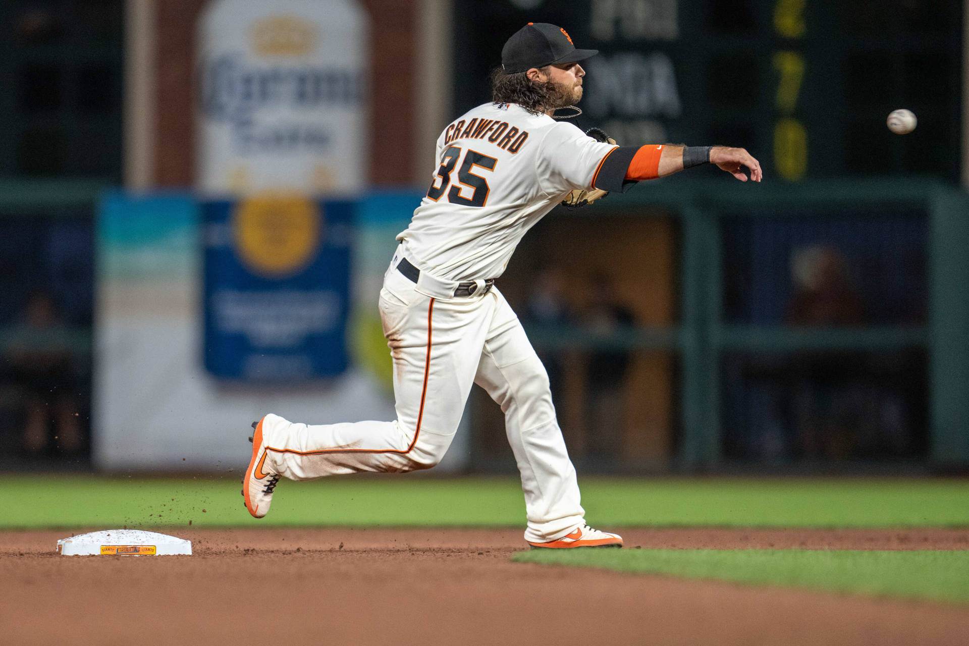 Brandon Crawford Throwing Ball While Running Background