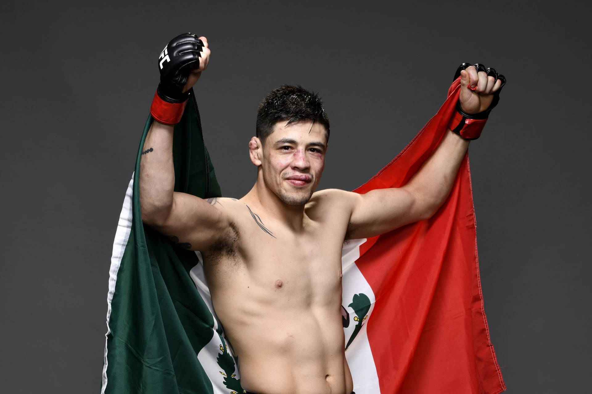 Brandon Moreno Holding Mexican Flag