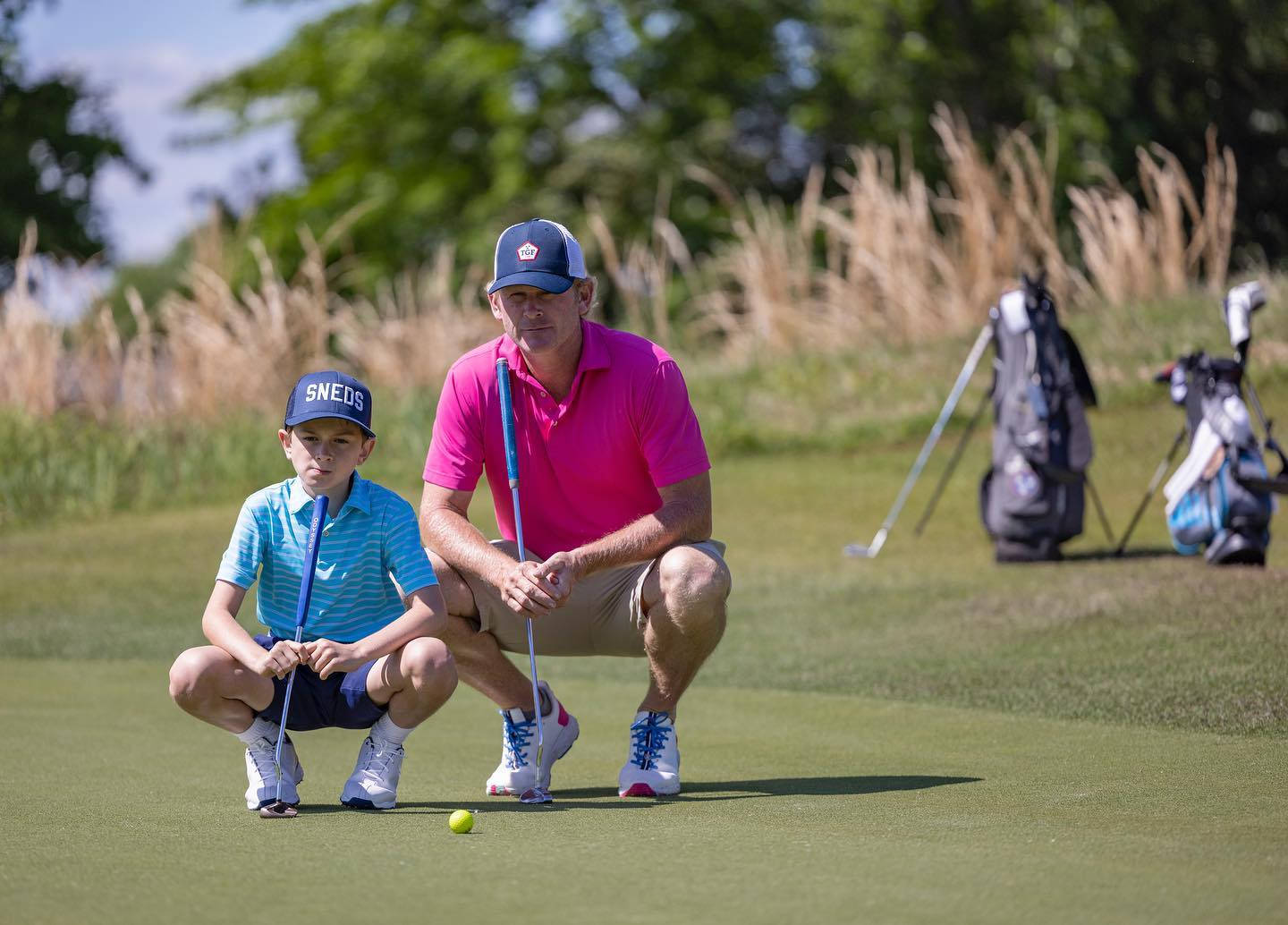 Brandt Snedeker And Son Playing Golf Background