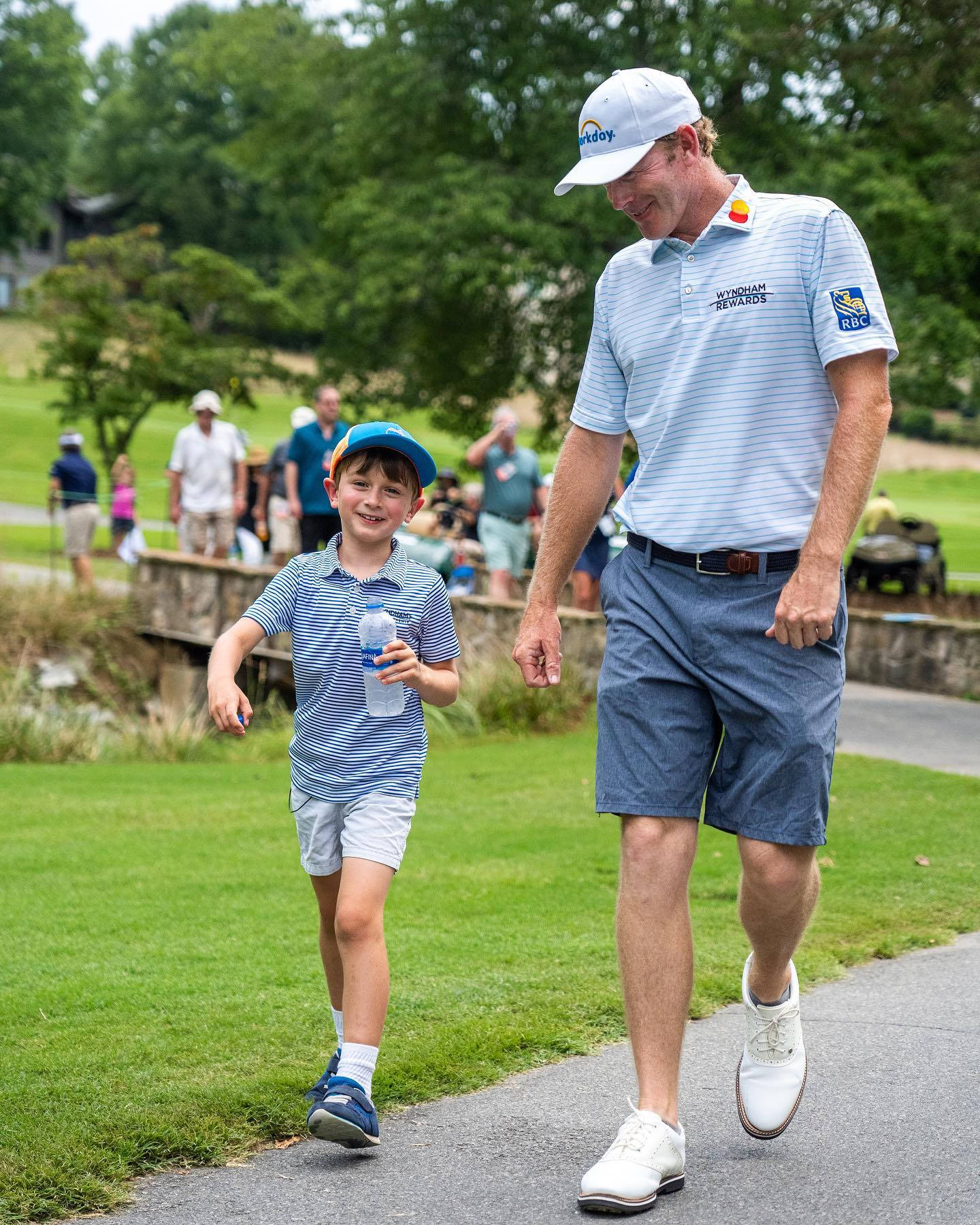 Brandt Snedeker And Son Walking Background