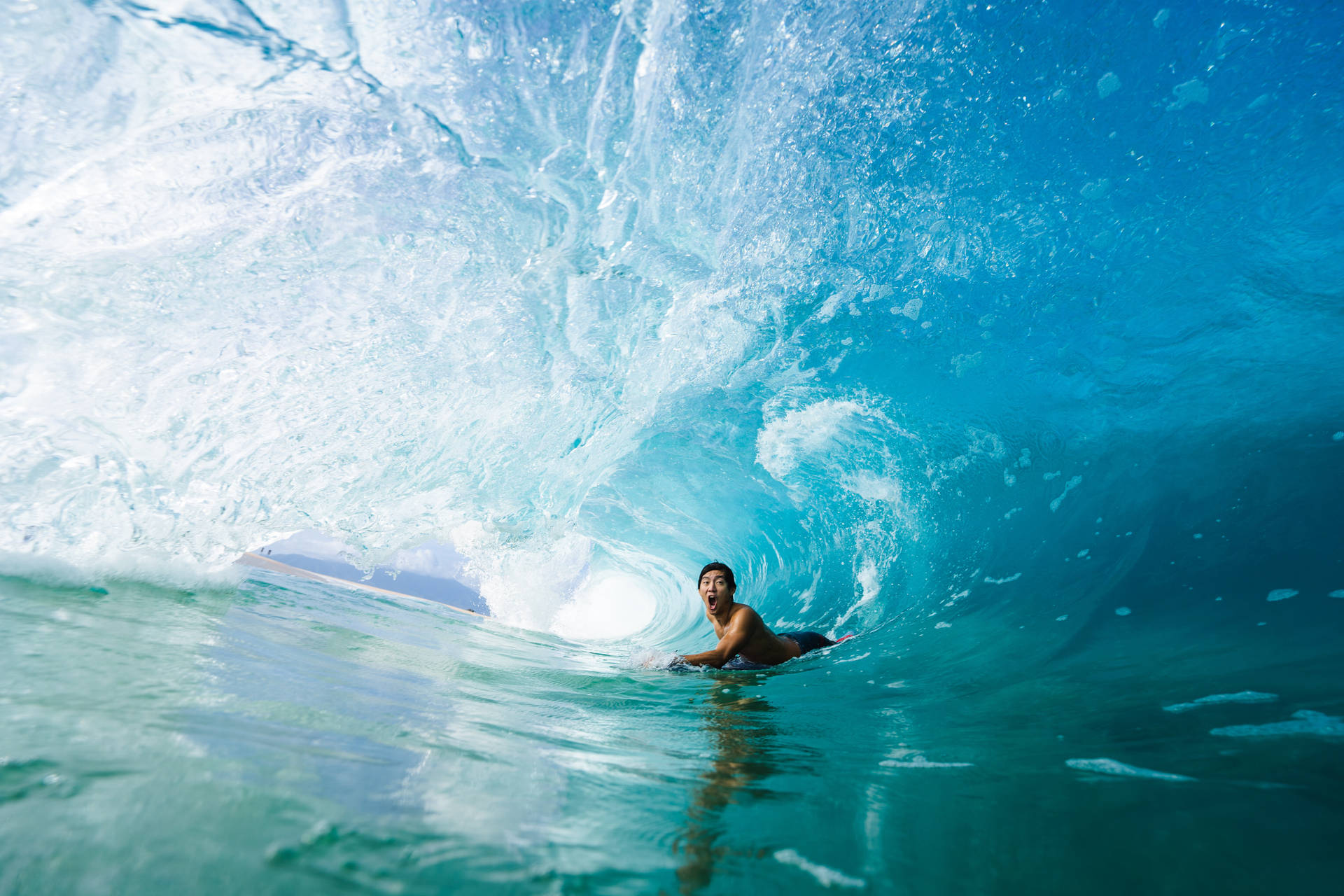 Brave Surfer In Waves Background