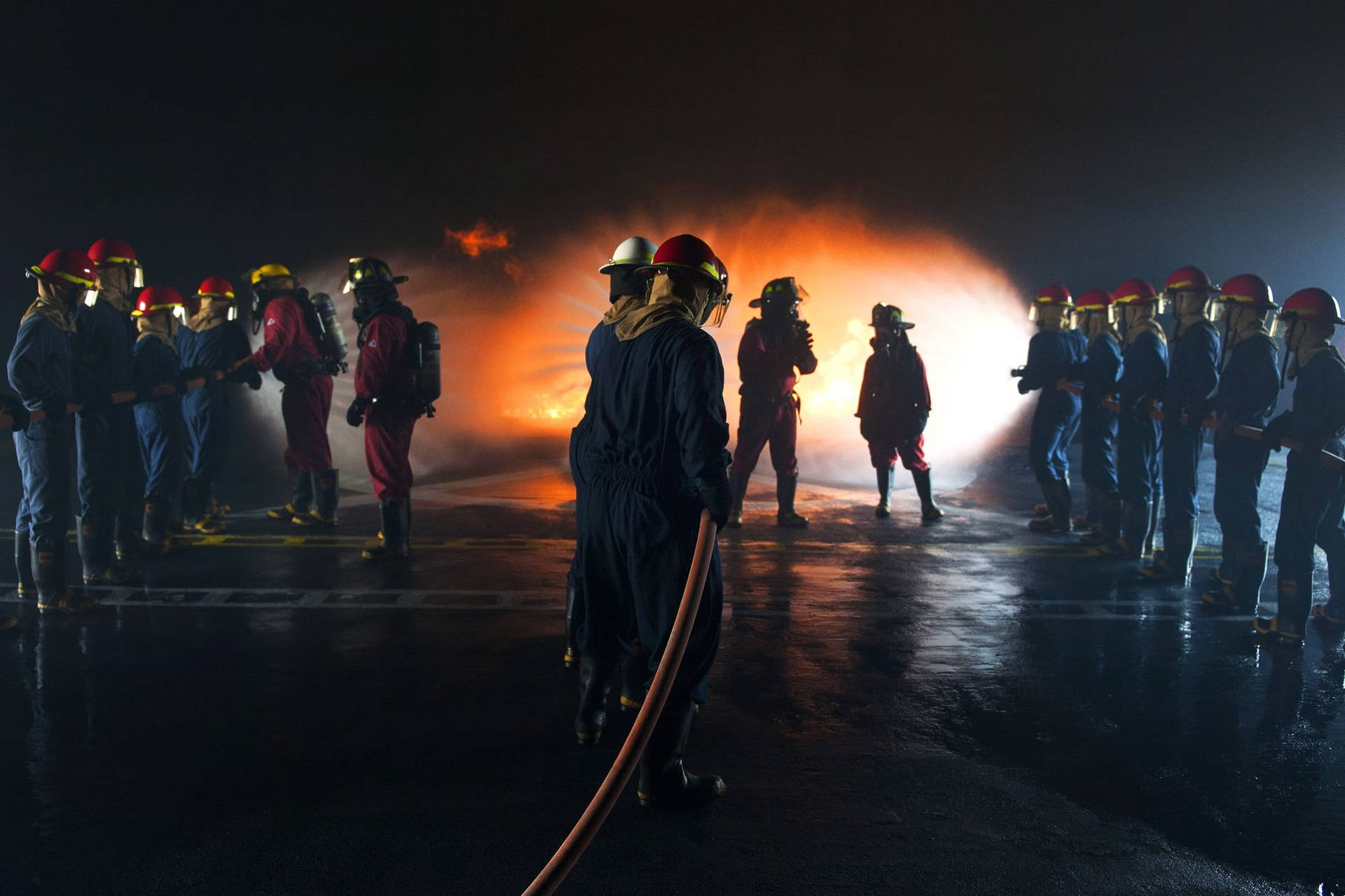 Bravery At Work: Firefighters During A Fire Drill Background