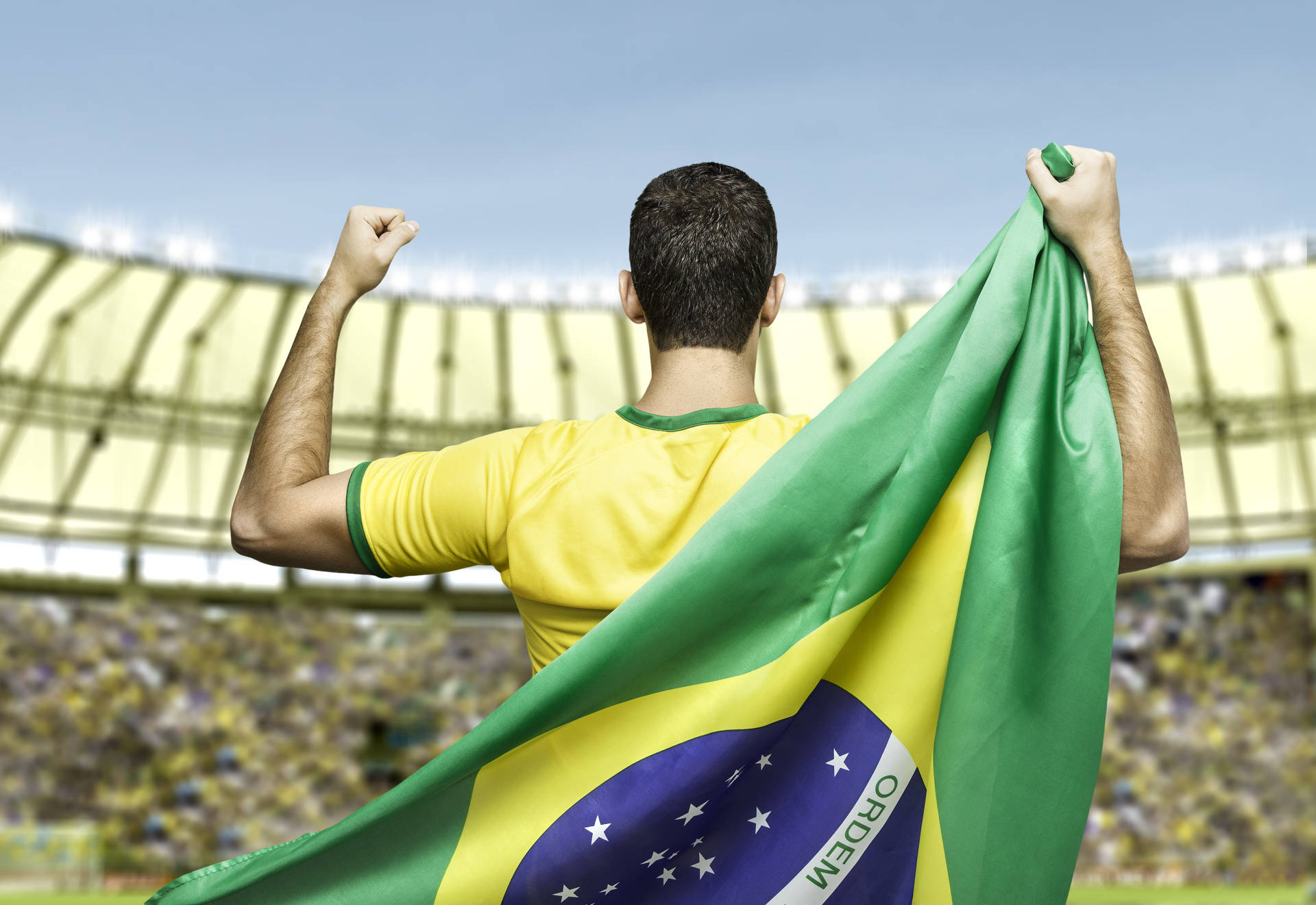 Brazil National Football Team Carrying Brazilian Flag Background