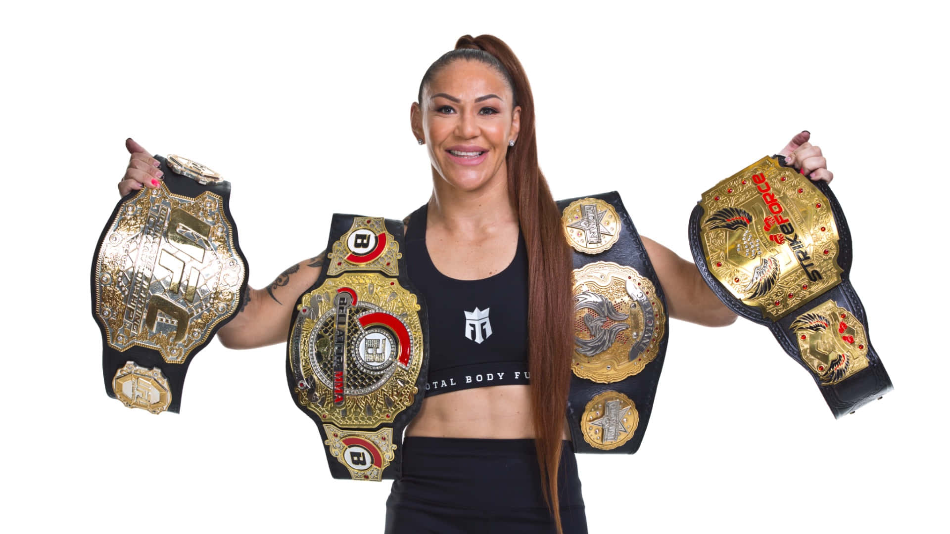 Brazilian-american Martial Artist Cris Cyborg Displaying Championship Belts Background