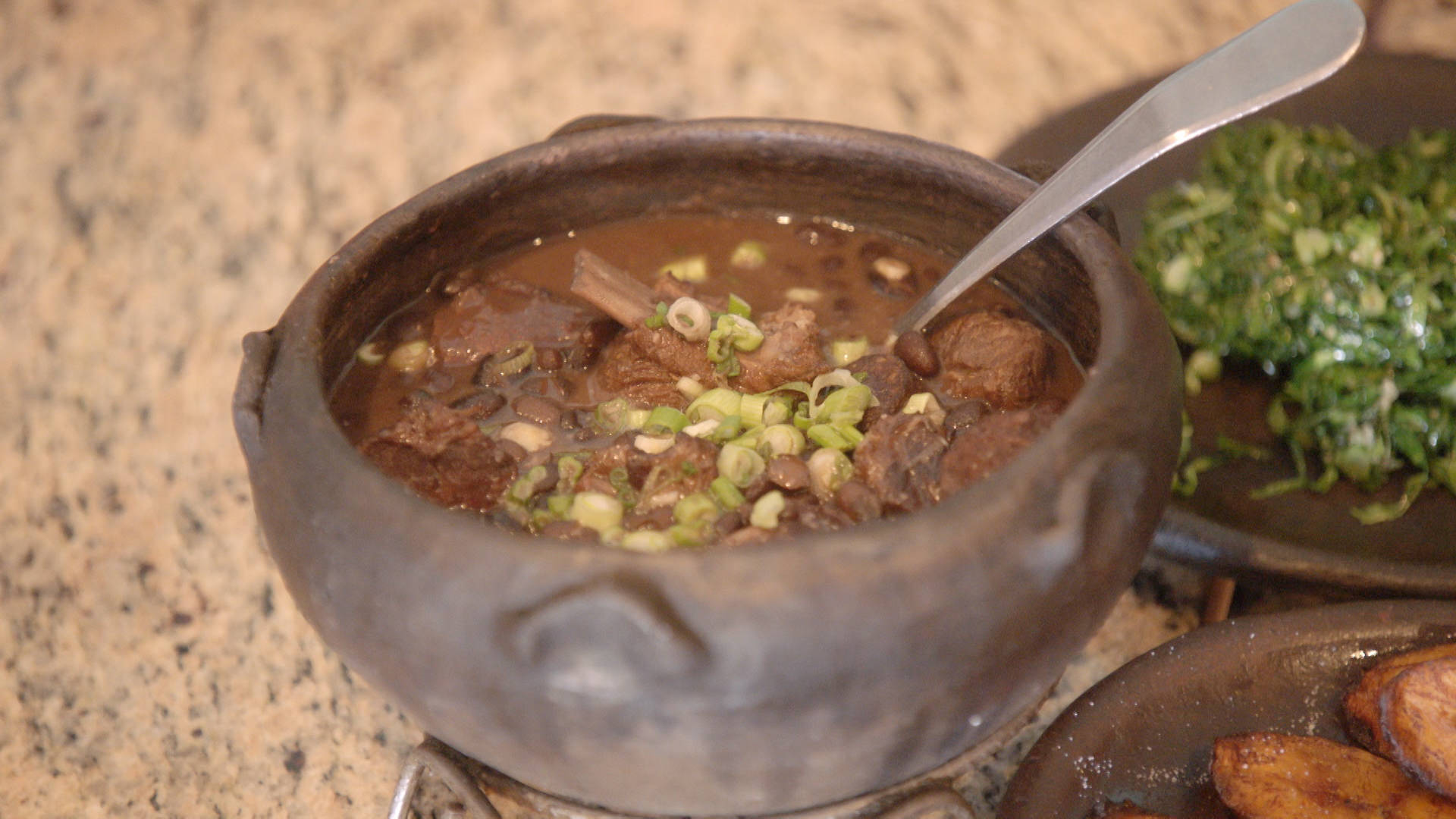 Brazilian Bean Stew Feijoada With Onion Rings Background