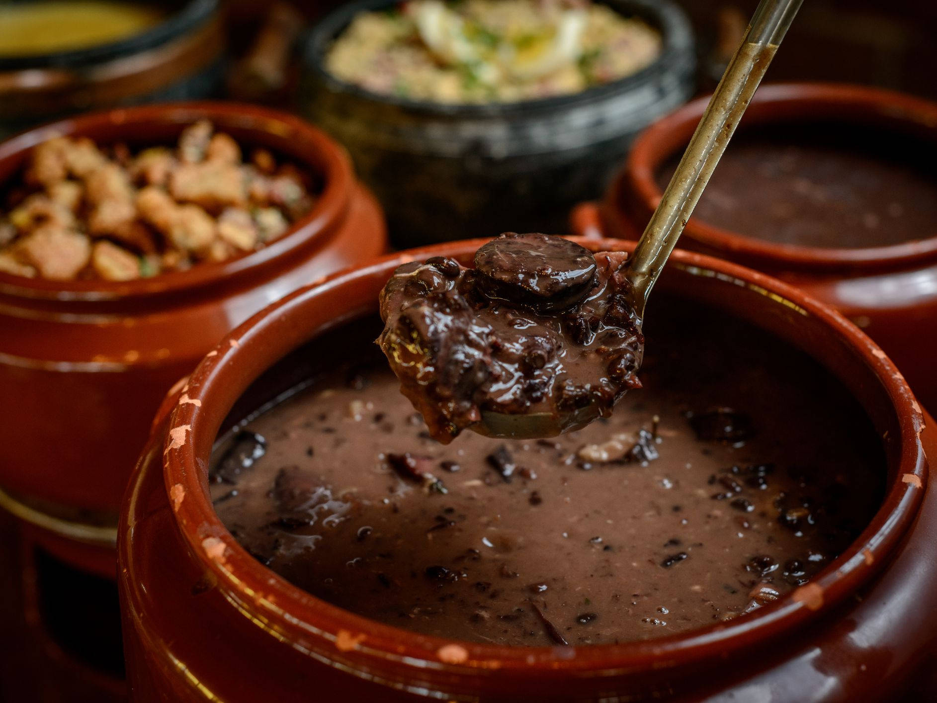 Brazilian Black Bean Stew Feijoada In Red Pot Background