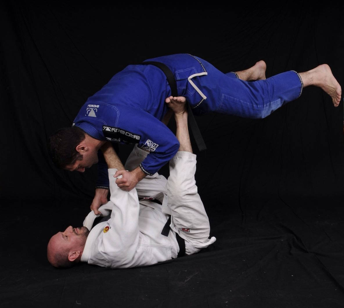 Brazilian Jiu-jitsu Practitioner Exhibiting The Mount Position Background