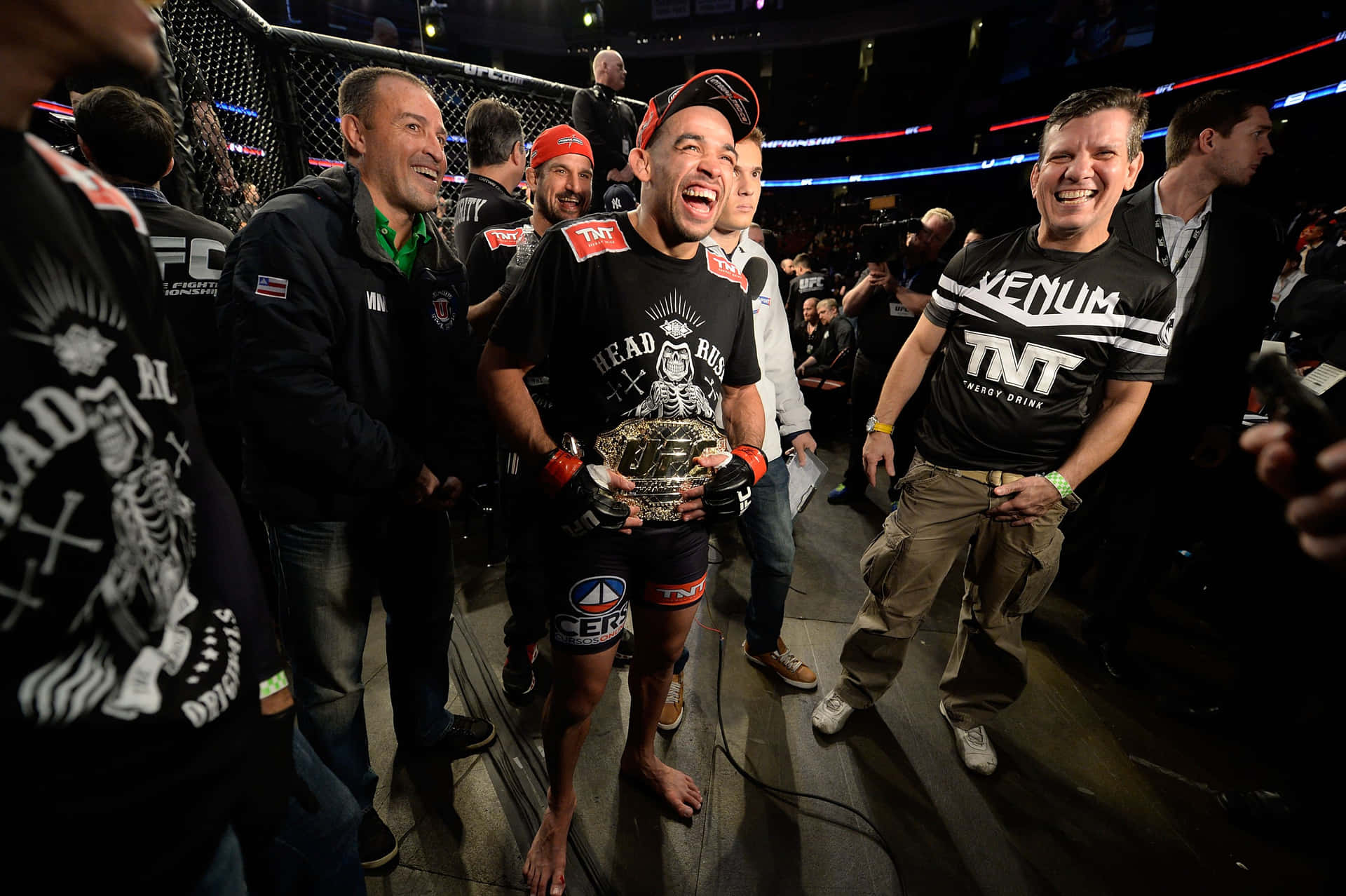 Brazilian Mixed Martial Artist Renan Barão Holding Belt Background