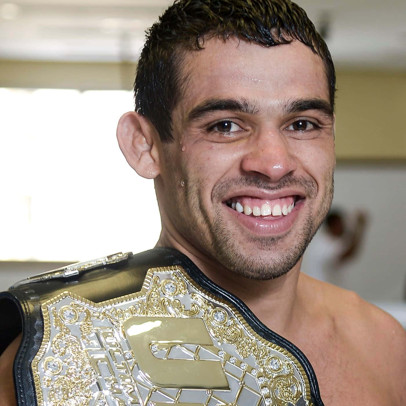 Brazilian Mixed Martial Artist Renan Barão With Ufc Belt Background