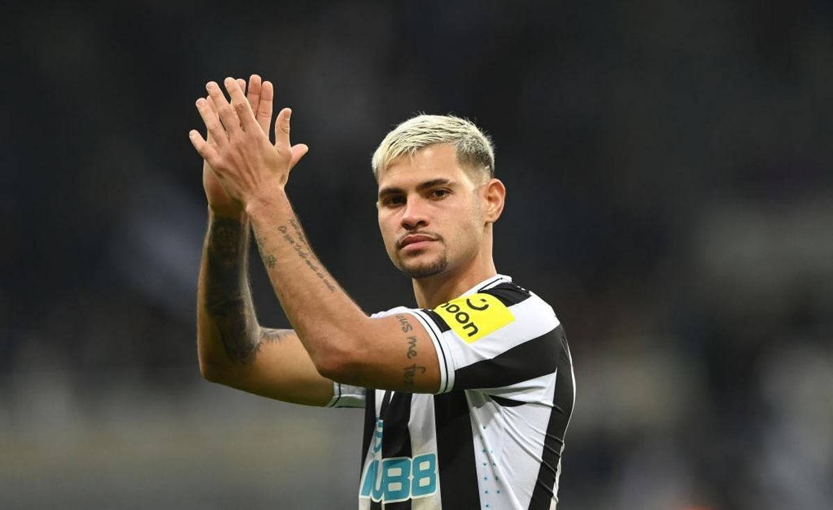 Brazilian Professional Footballer Bruno Guimarães Applauding On The Field Background