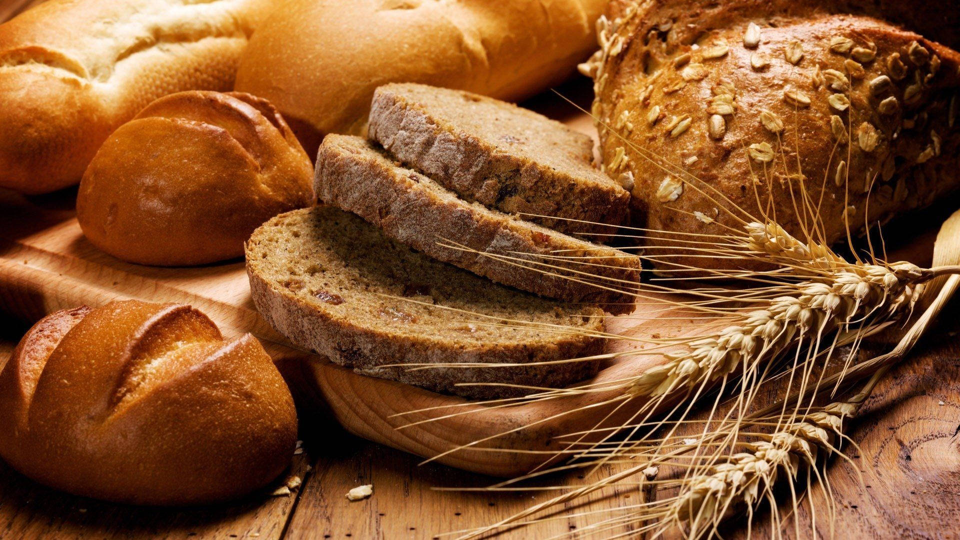 Breads On Board With Wheat Background