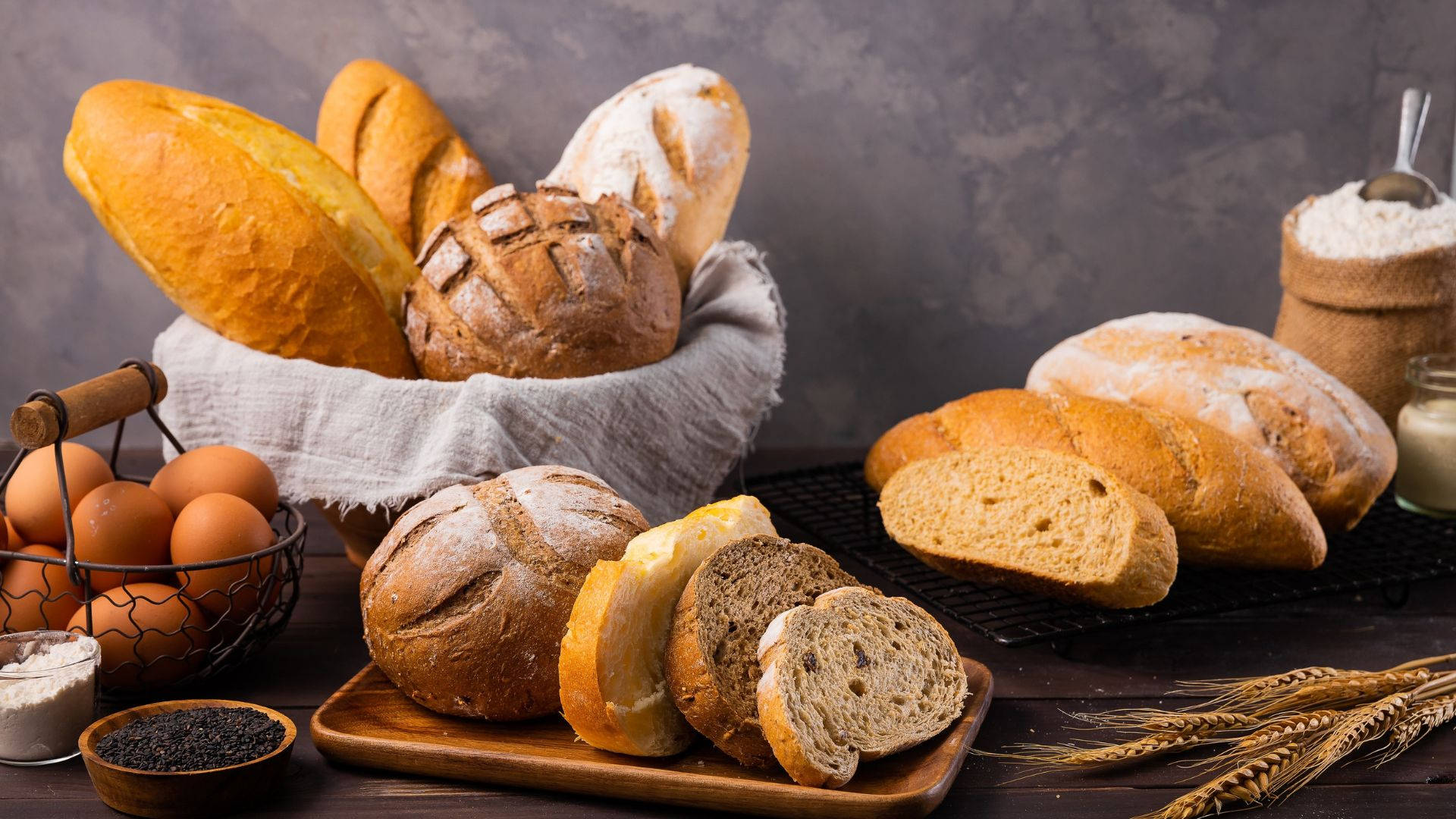 Breads With Eggs, Flour, And Wheat Background
