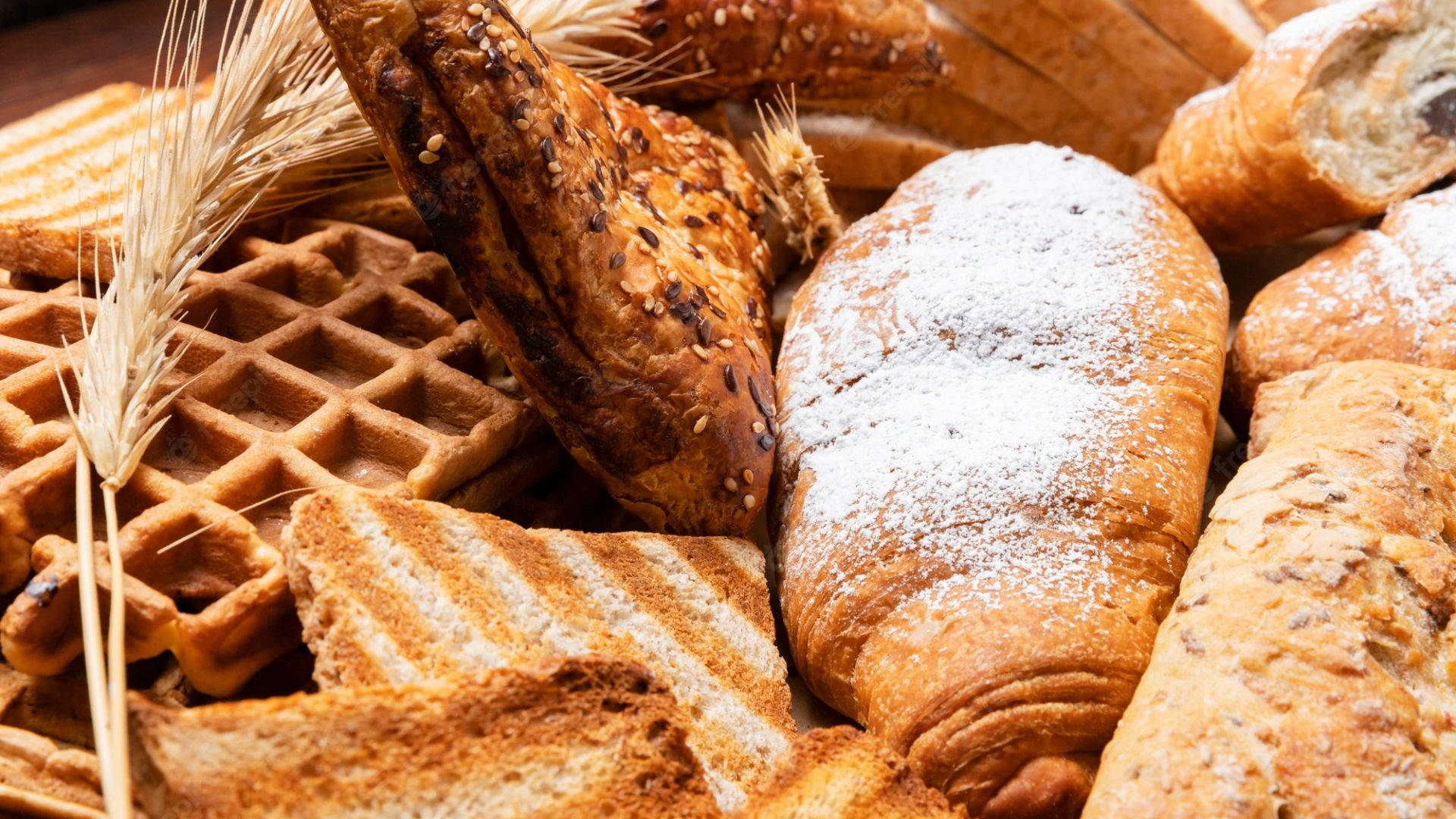 Breads With Waffles And Wheat Background