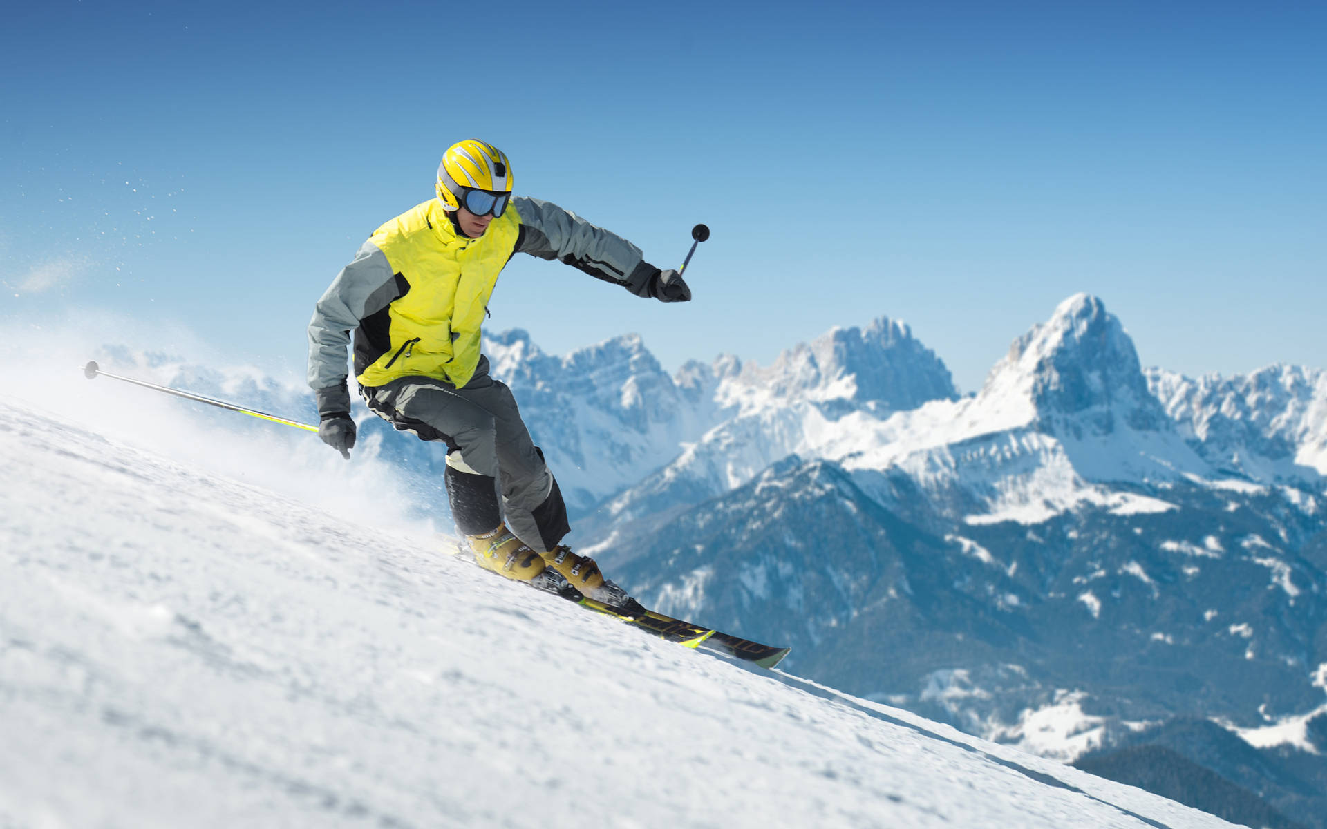 Breathtaking Alpine Skiing Adventure In The Snowy Mountains Background