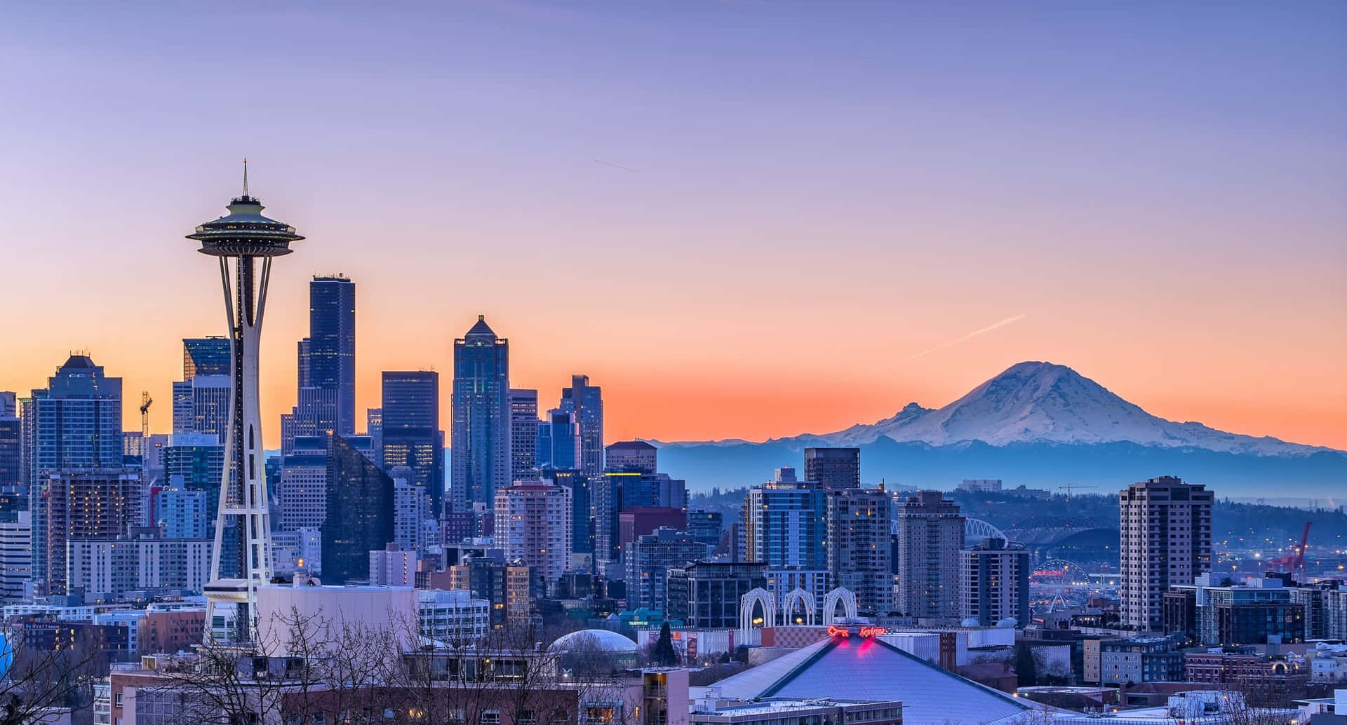 Breathtaking Skyline Of Seattle At Night Background