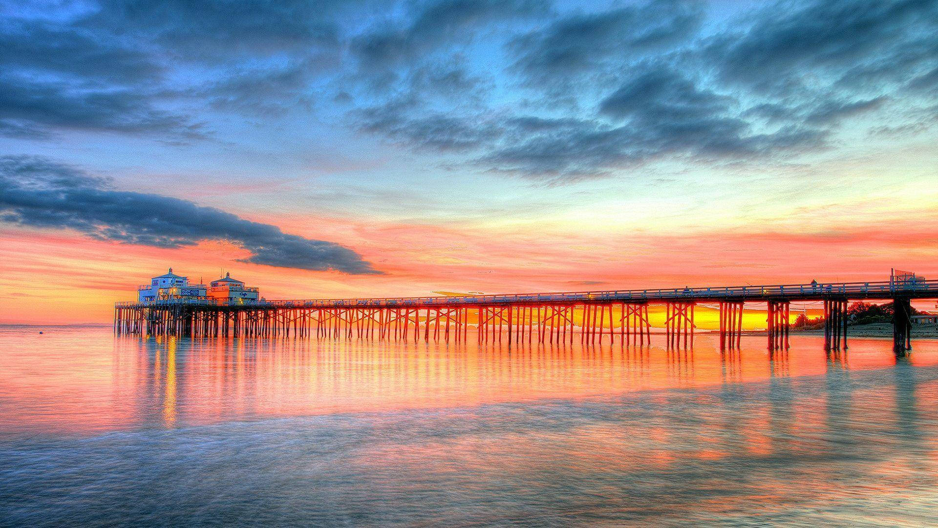 Breathtaking Sunset Over Malibu, California Background