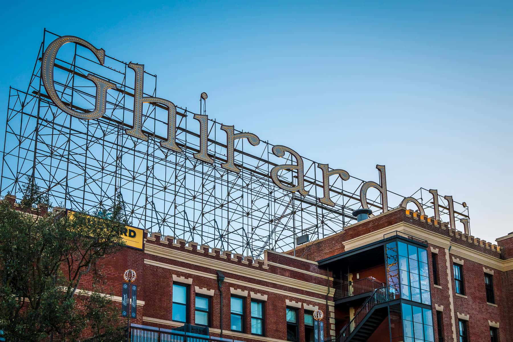 Breathtaking View Of Ghirardelli Square Atop A Classic Brick Building
