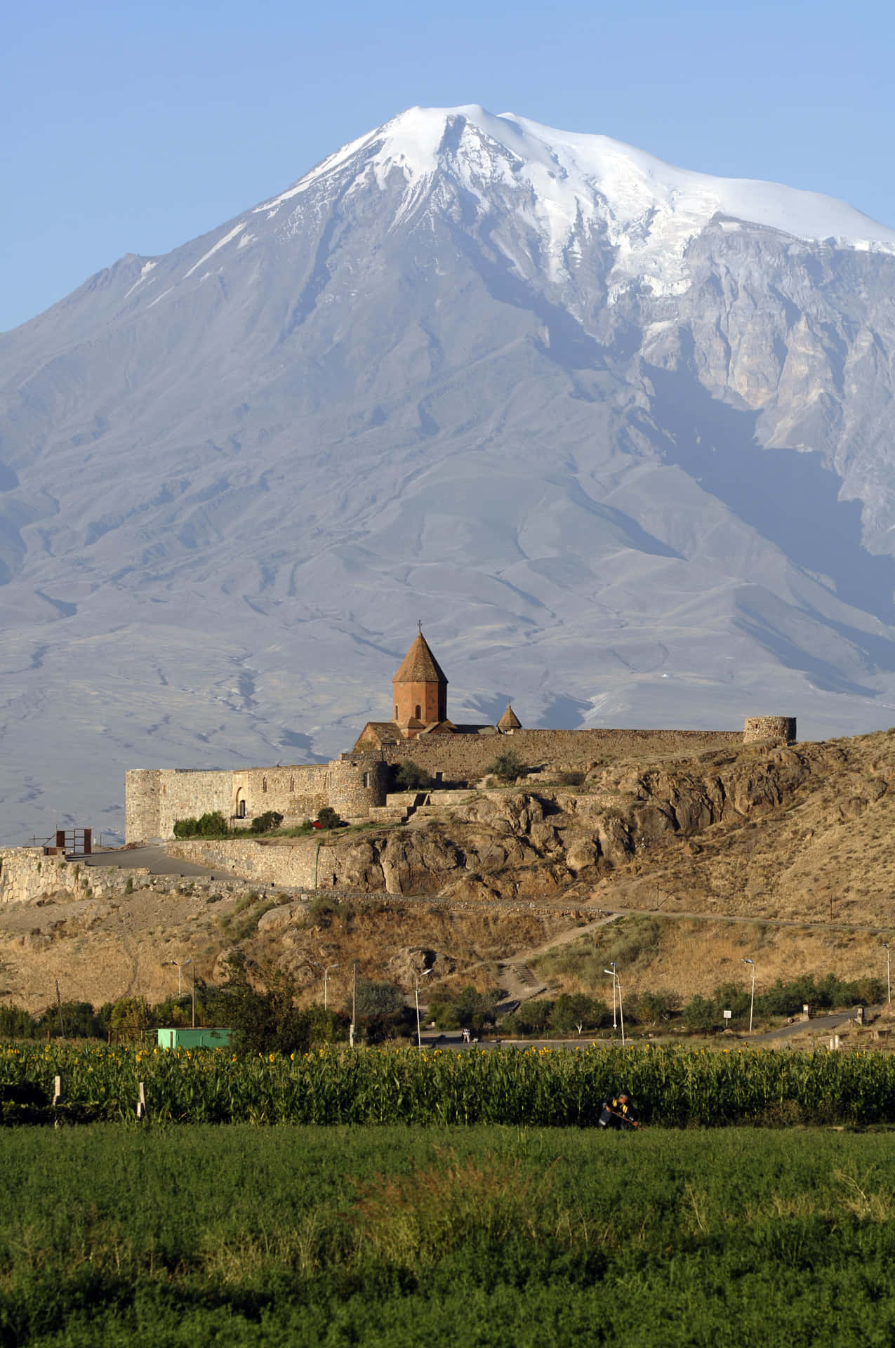 Breathtaking View Of Khor Virap Monastery Against Majestic Mountains Background