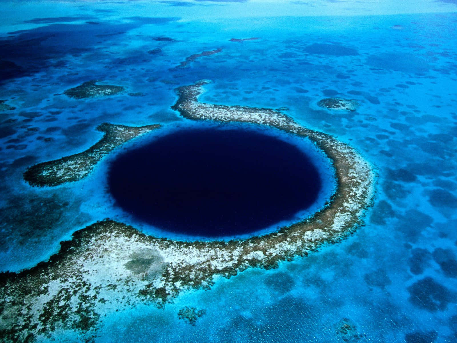 Breathtaking View Of The Great Blue Hole, Belize Background
