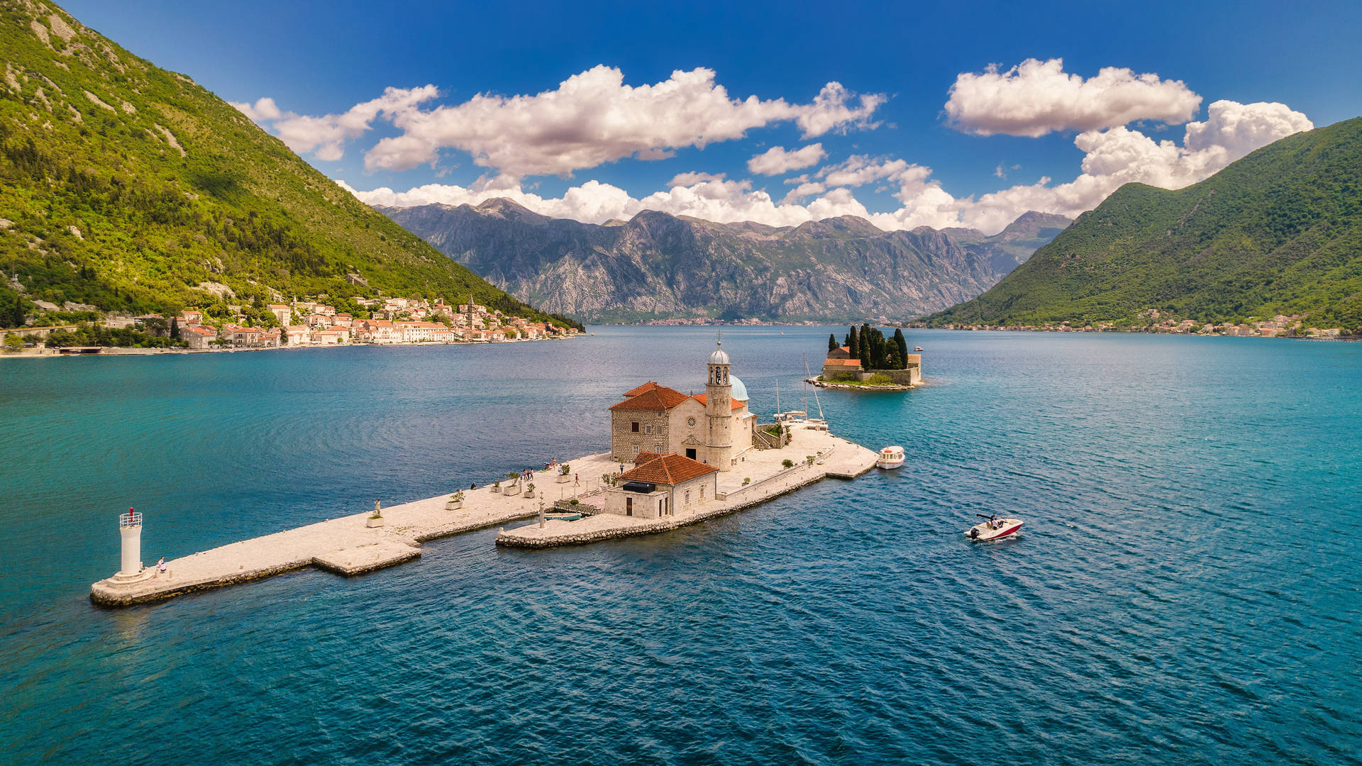 Breathtaking View Of The Iconic Our Lady Of The Rocks In Kotor Bay. Background