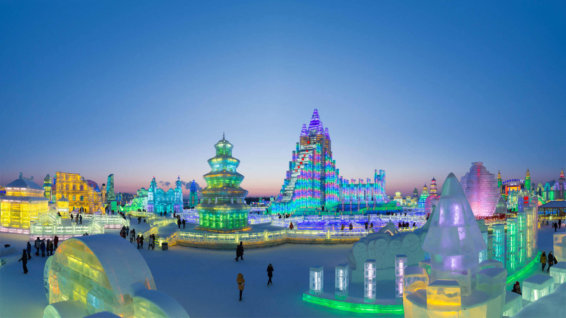 Breathtaking View Of The Vibrant Ice Structures At The Harbin Ice Festival Background