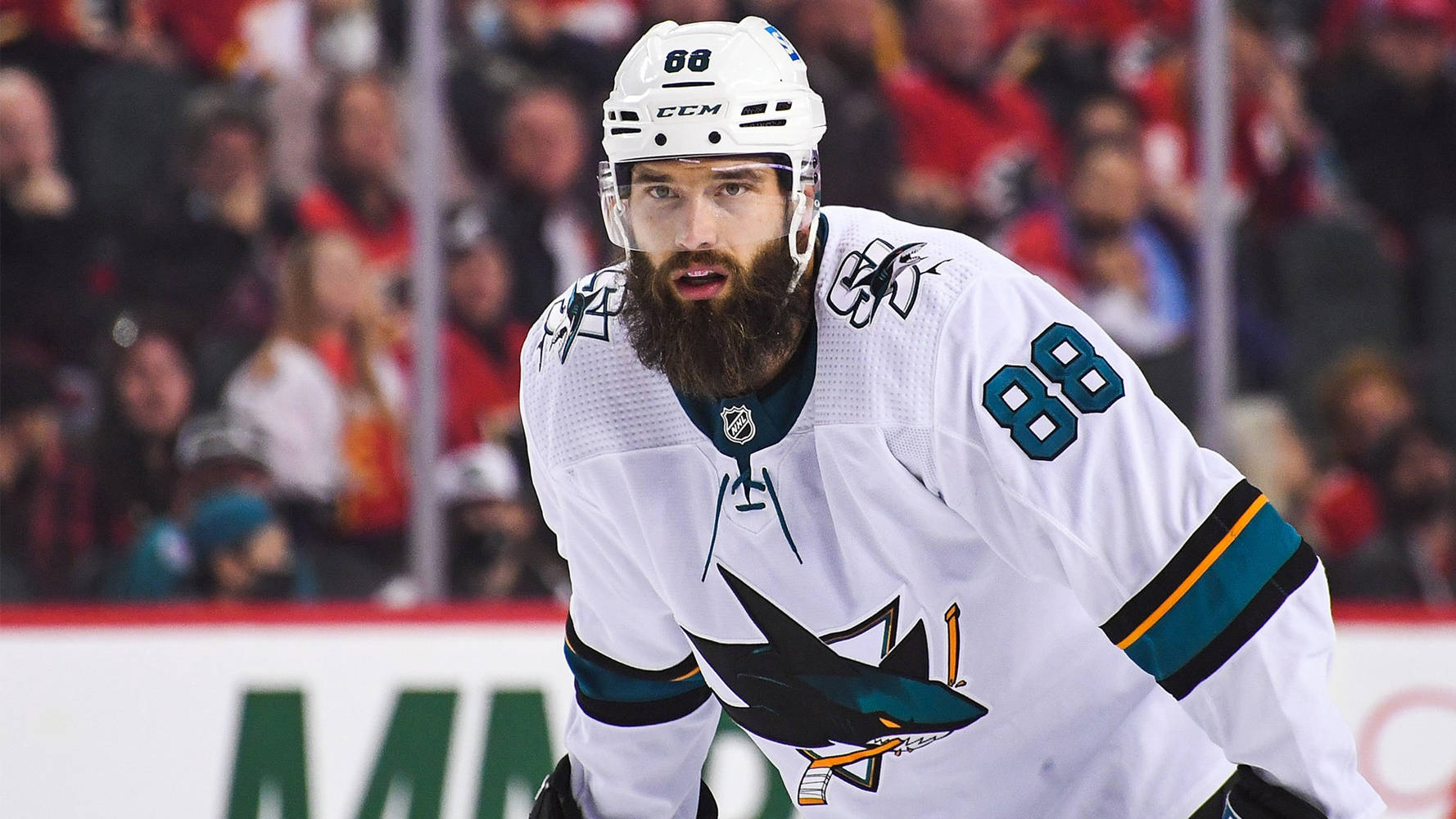 Brent Burns Of San Jose Sharks In Action Against Buffalo Sabres Background