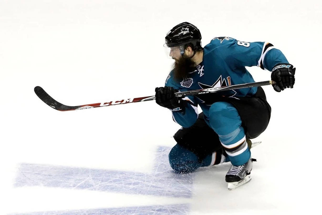 Brent Burns Waiting Puck Knees Down Background