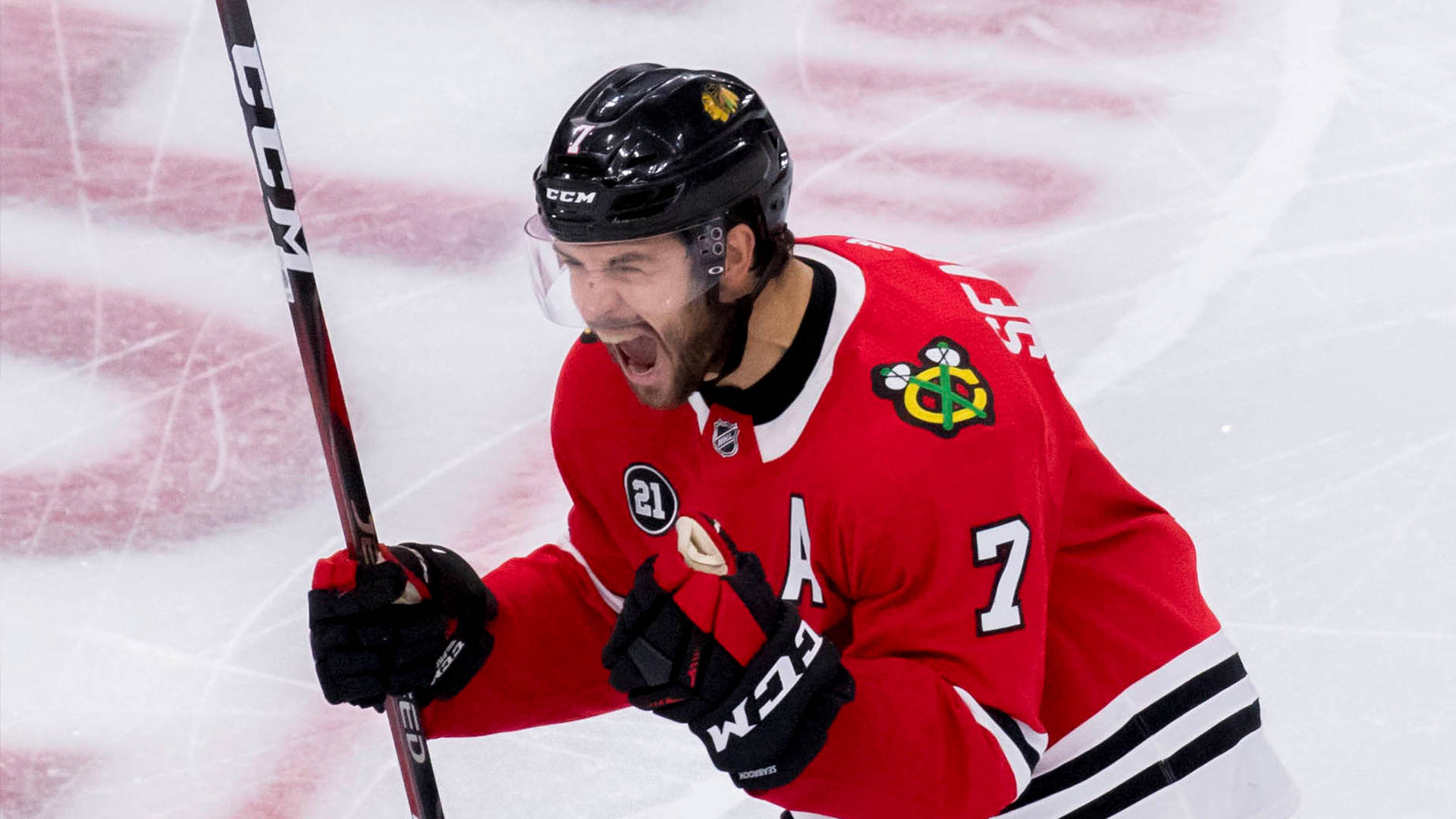 Brent Seabrook In Action On The Ice Rink Background