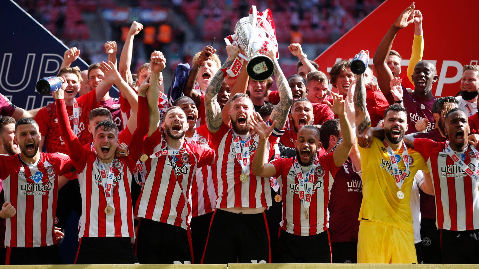 Brentford Fc Players Celebrating Background