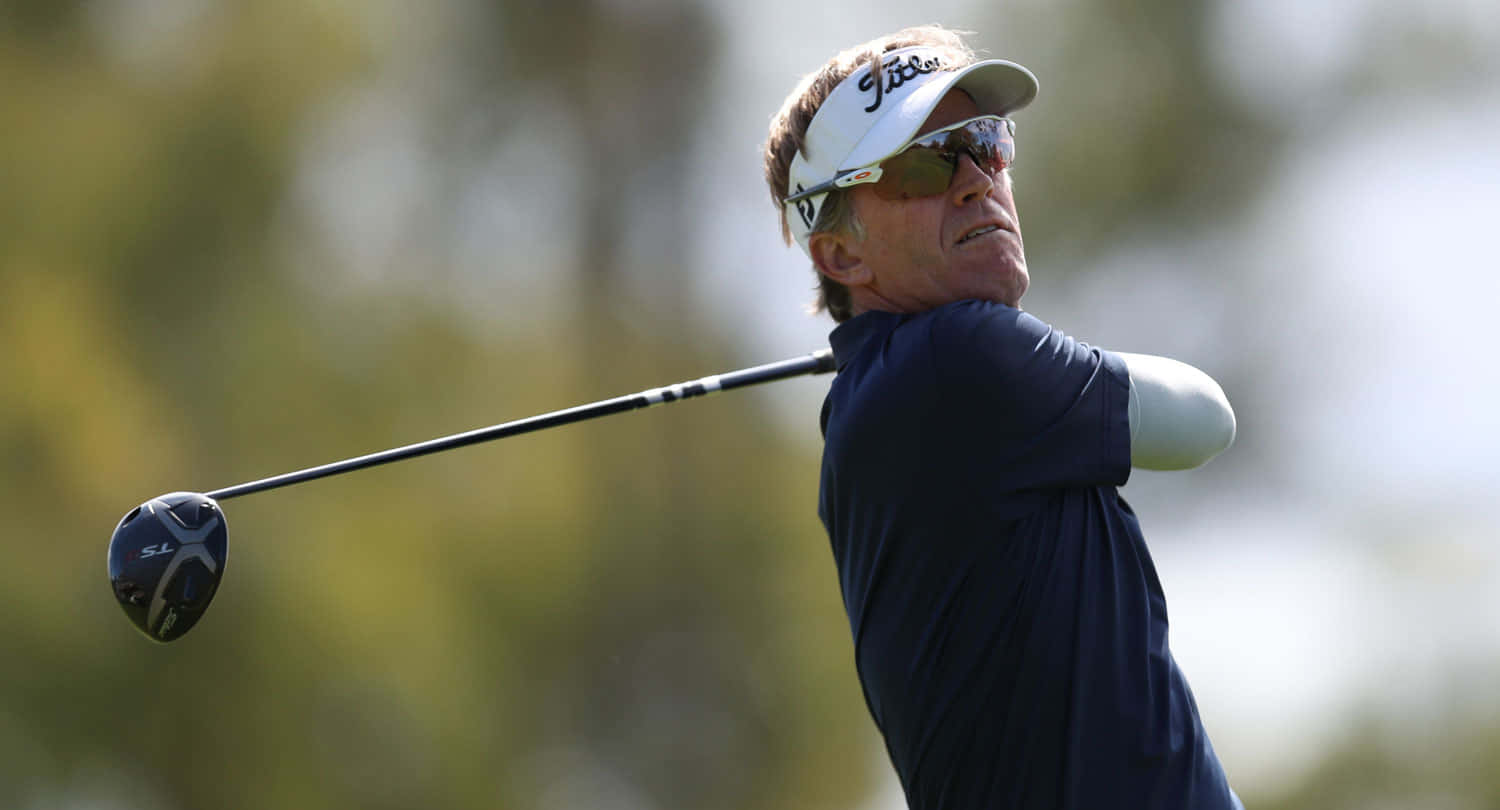 Brett Quigley Focused During A Golf Competition Background