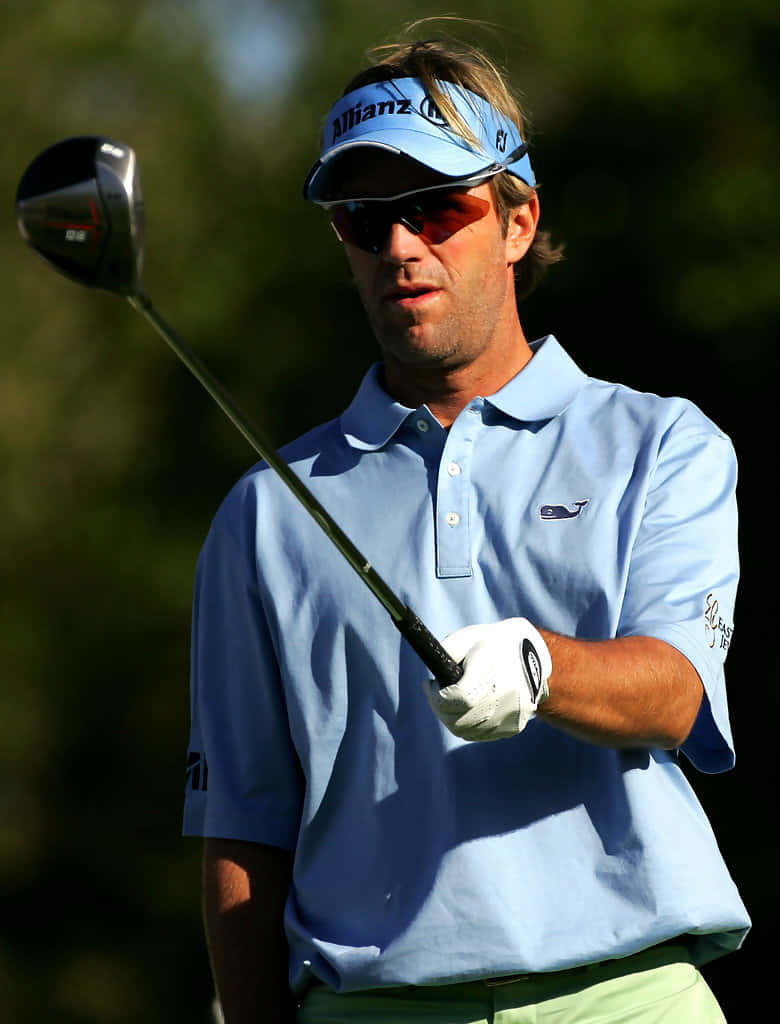 Brett Quigley Holding Golf Club Forward Background