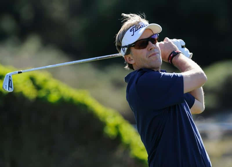 Brett Quigley In Action On The Golf Course Background