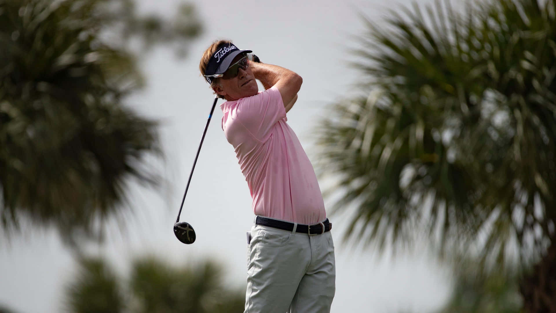 Brett Quigley Perfectly Executing A Follow-through In Golf Play Background