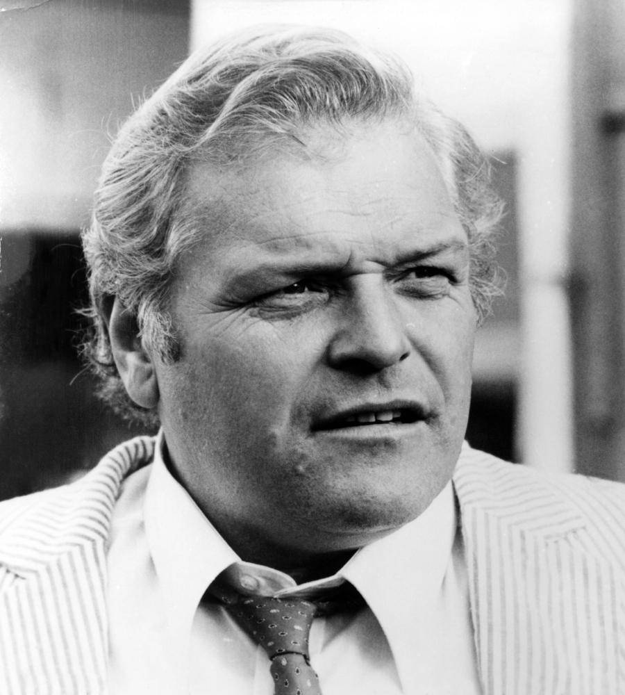 Brian Dennehy Black And White In White Suit Background