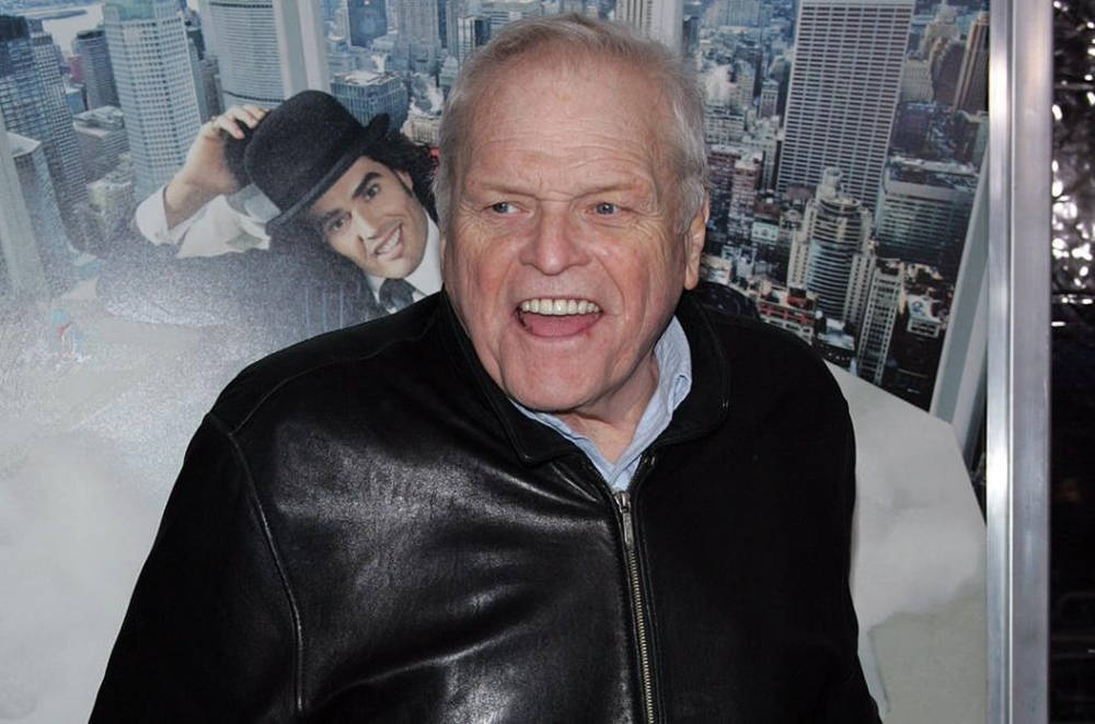 Brian Dennehy In Black Jacket City Background