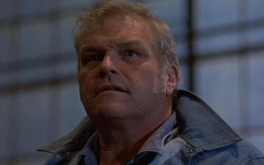 Brian Dennehy Looking Up Gray Jacket Background