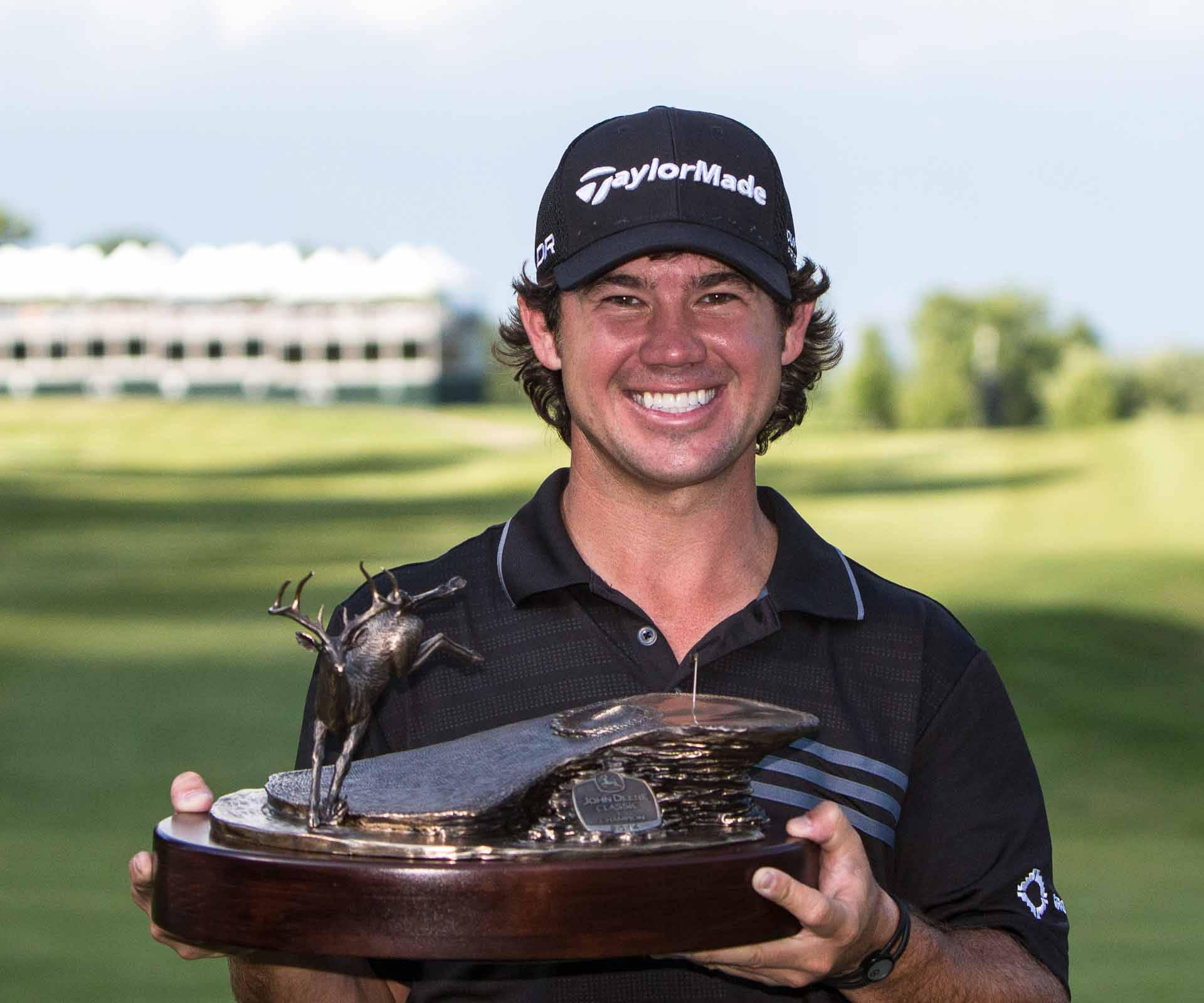 Brian Harman Holding Trophy Background