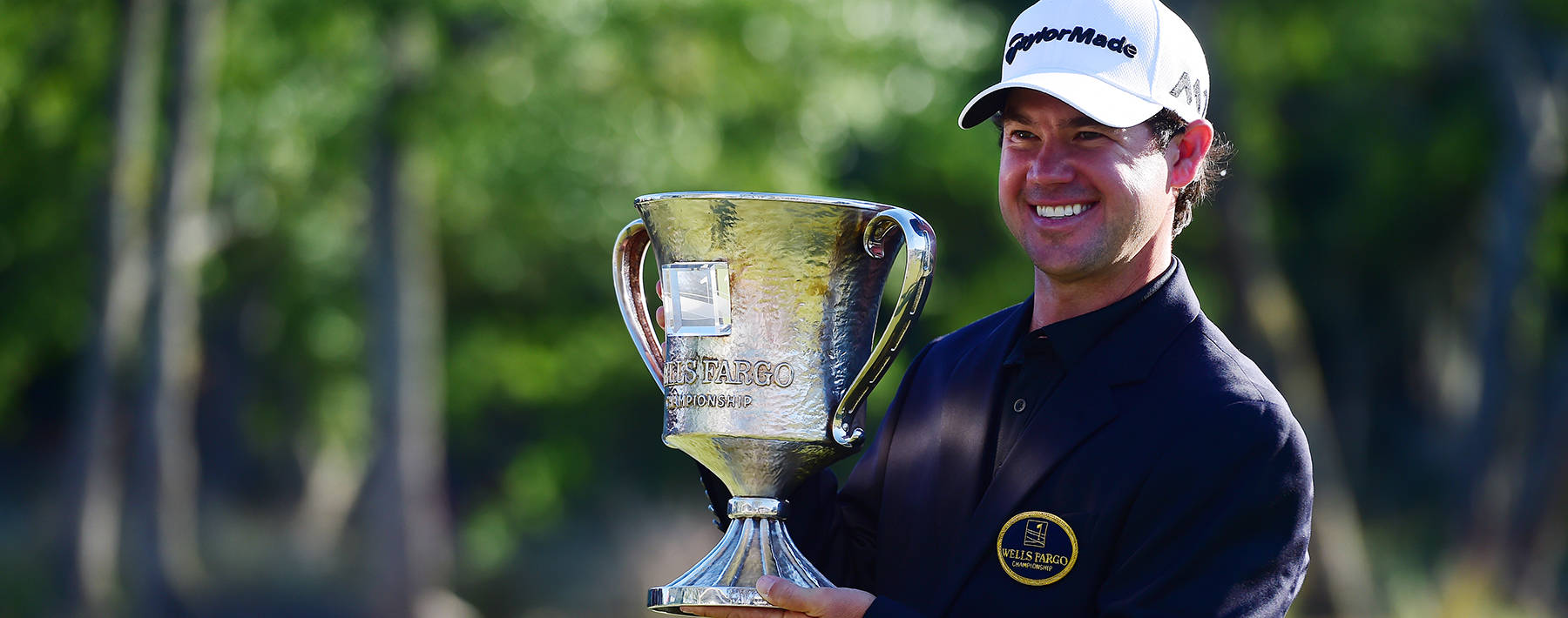 Brian Harman Smiling With Trophy Background