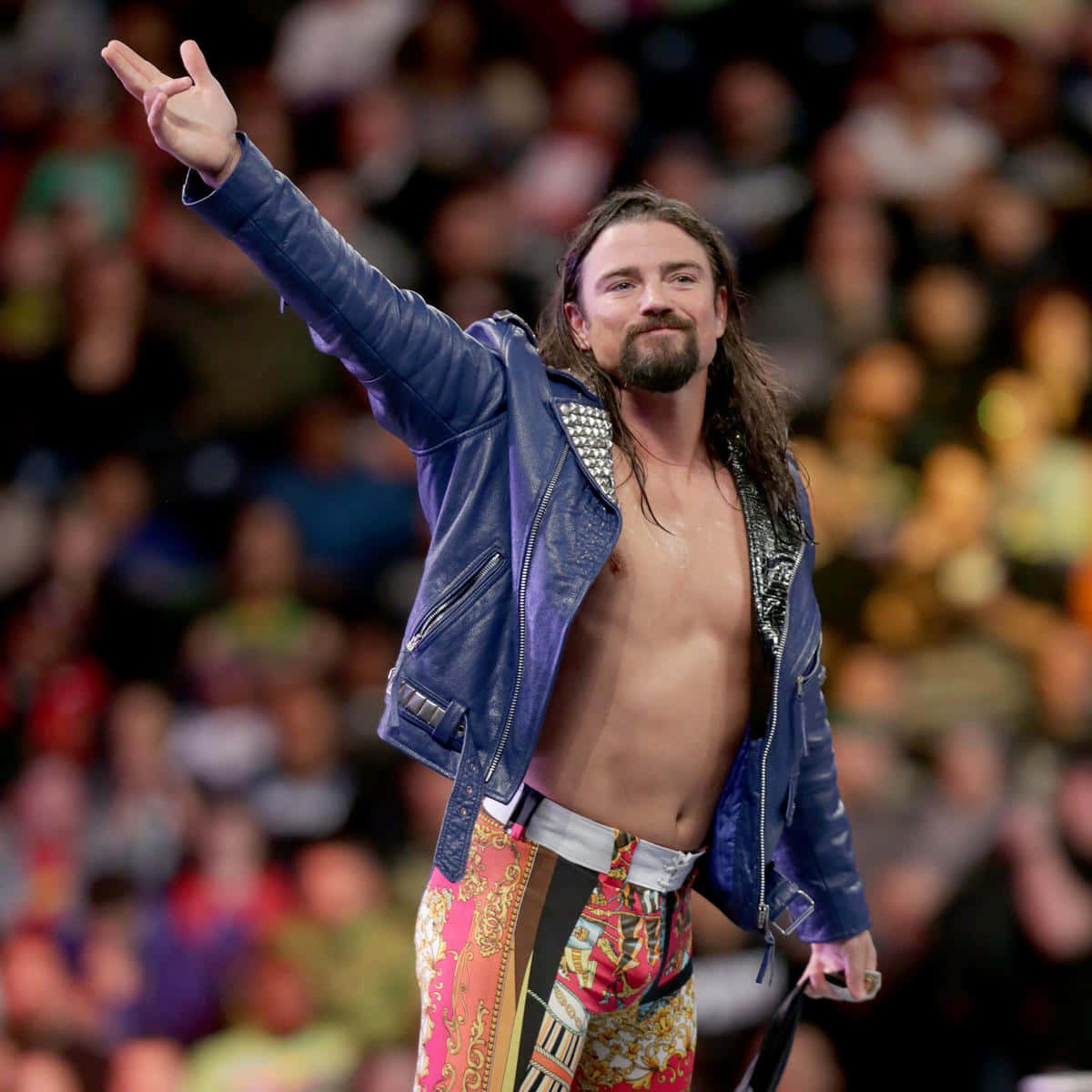 Brian Kendrick Dominating In The Wrestling Ring Background