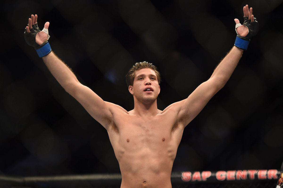 Brian Ortega Bare Chest Arms Raised Background