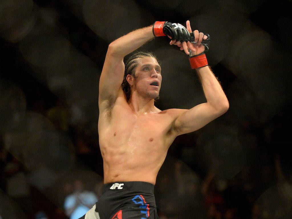 Brian Ortega Gestures At Crowd Background