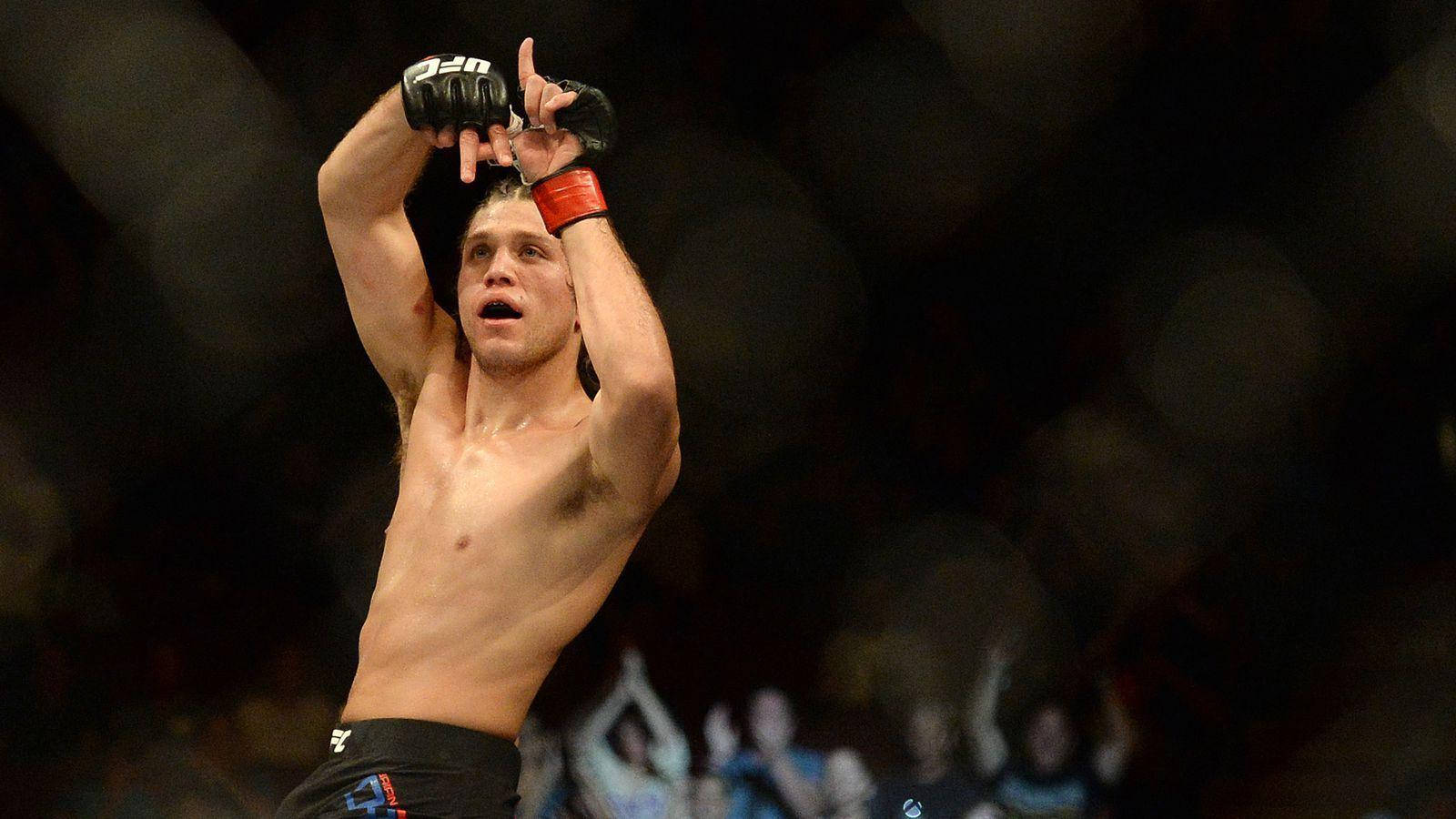 Brian Ortega Gesturing Two Hands Background