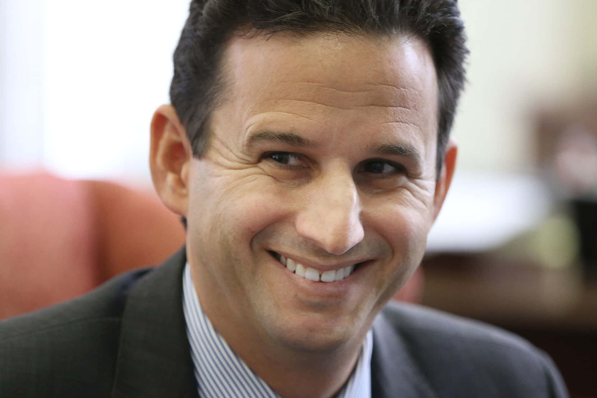 Brian Schatz Grinning Background