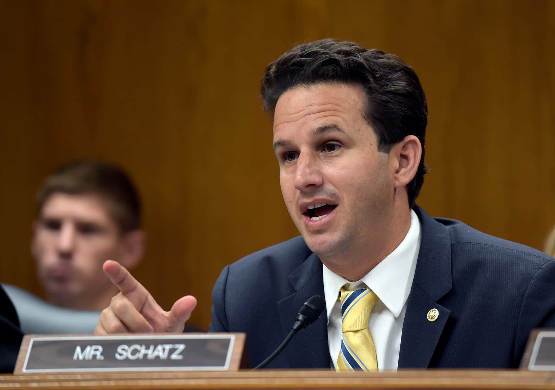 Brian Schatz Speaking In Senate Panel Background