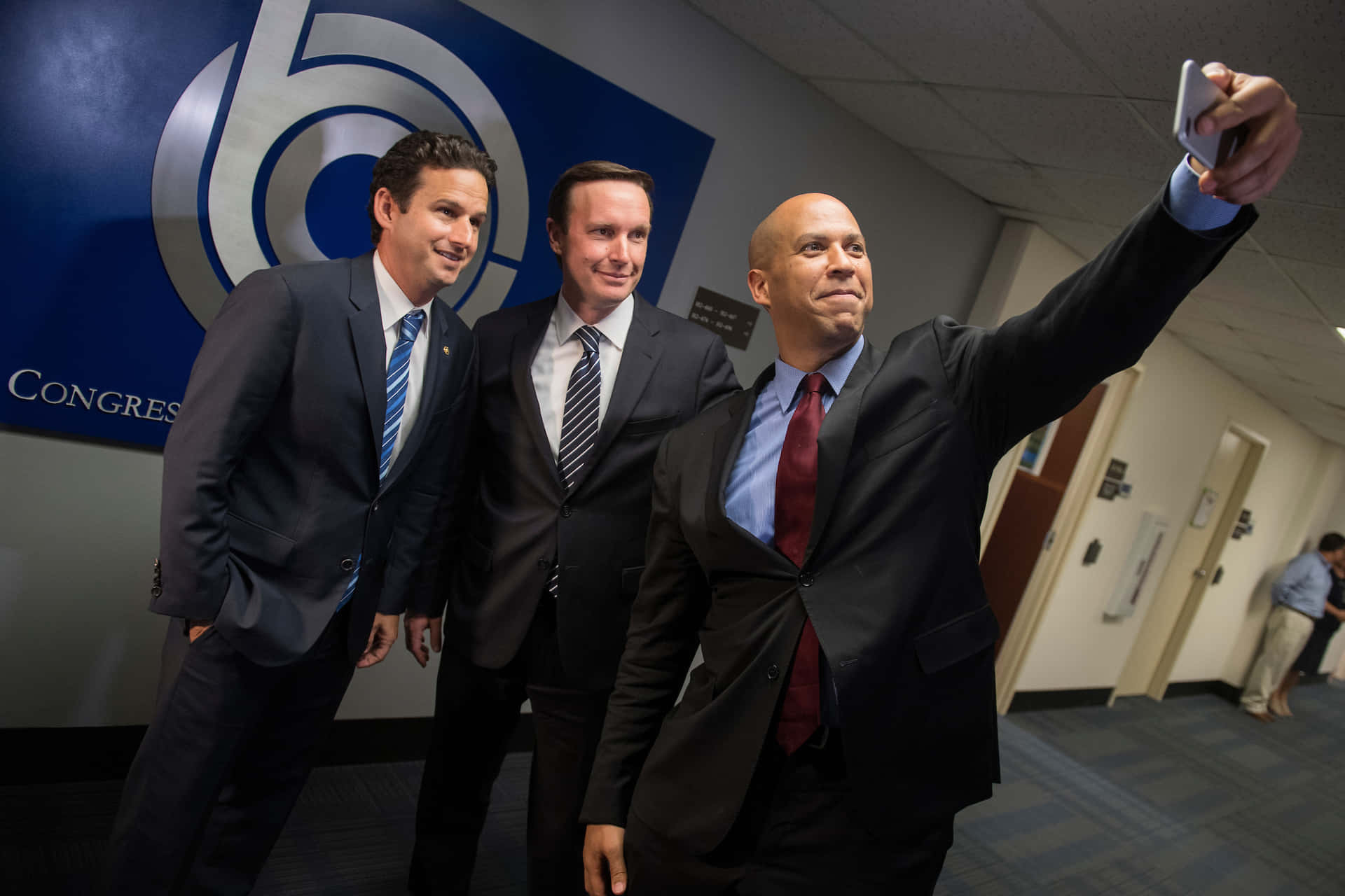 Brian Schatz Takes A Selfie Along With Cory Booker Background