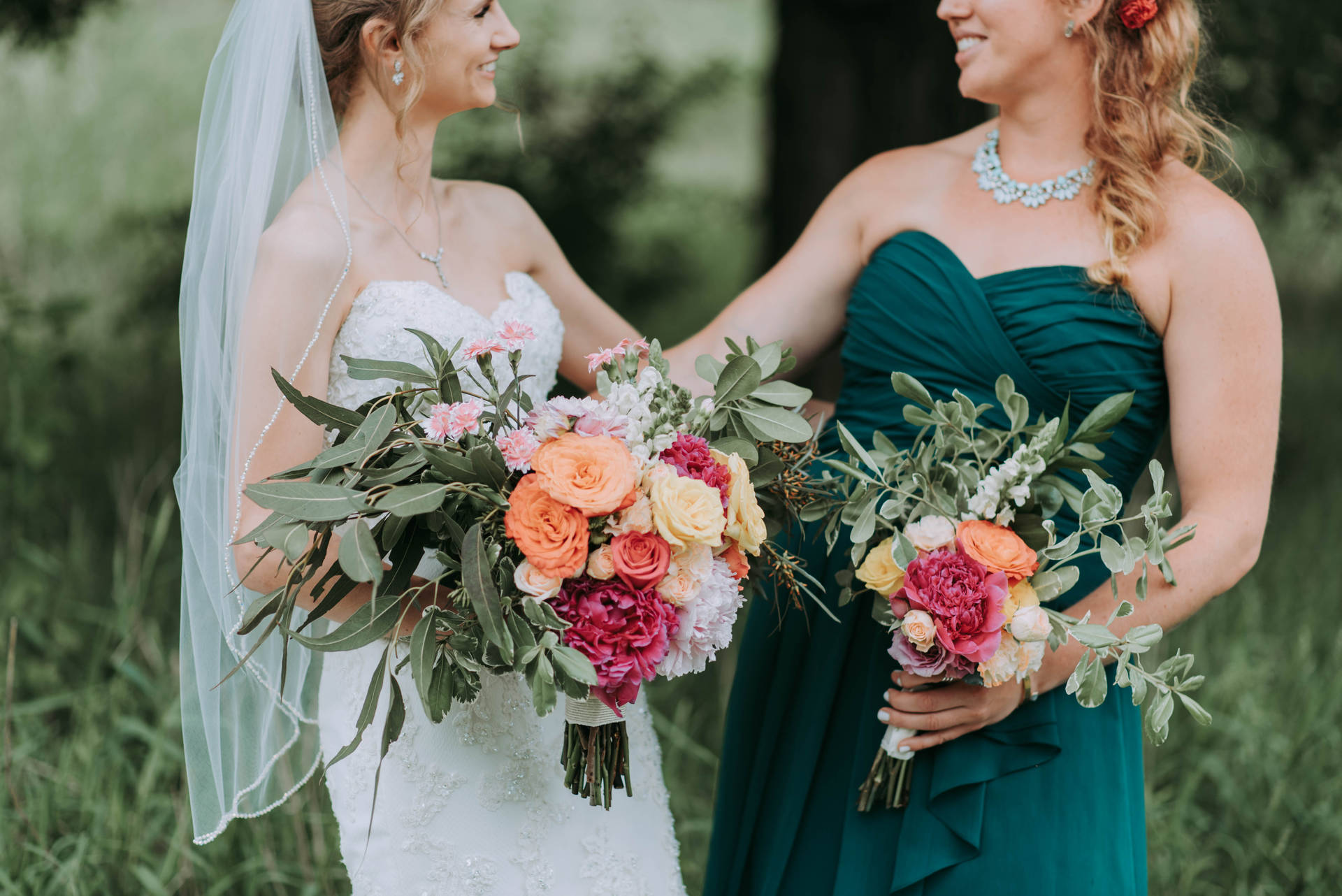 Bride And Bridesmaid With Flowers Background