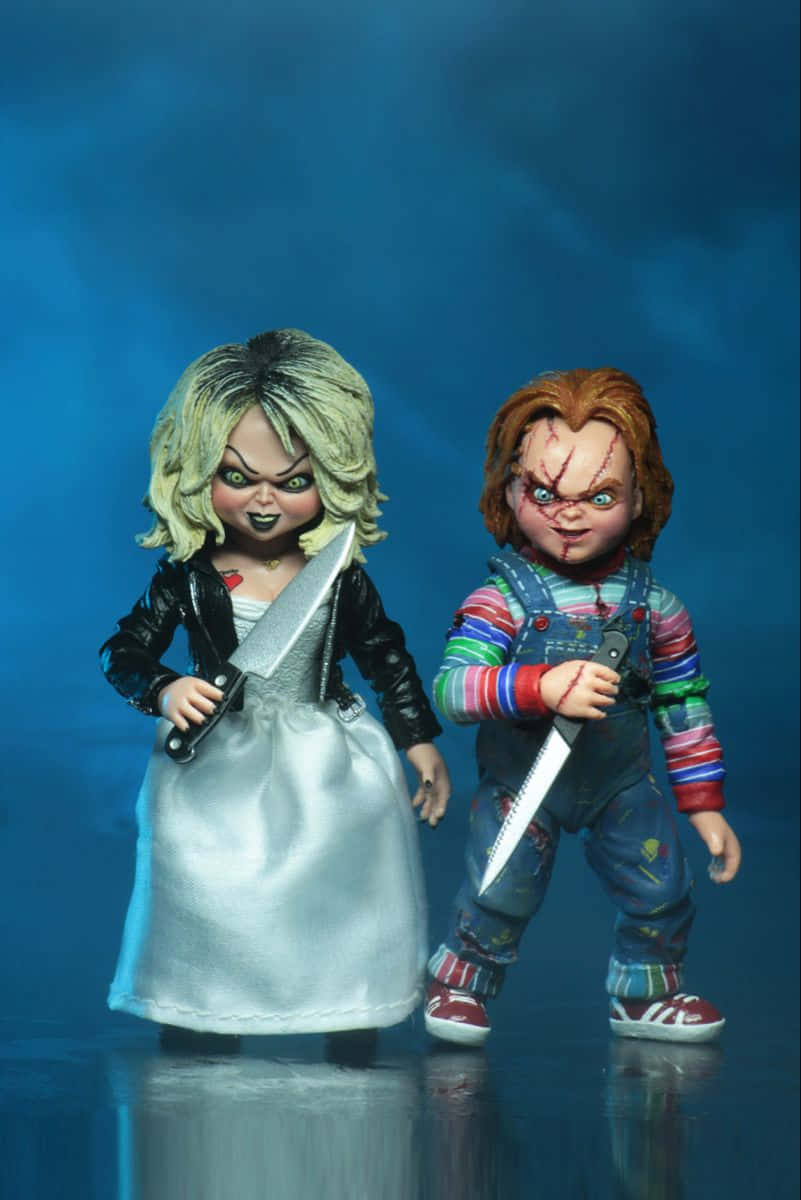 Brideand Chucky Dolls With Knives Background