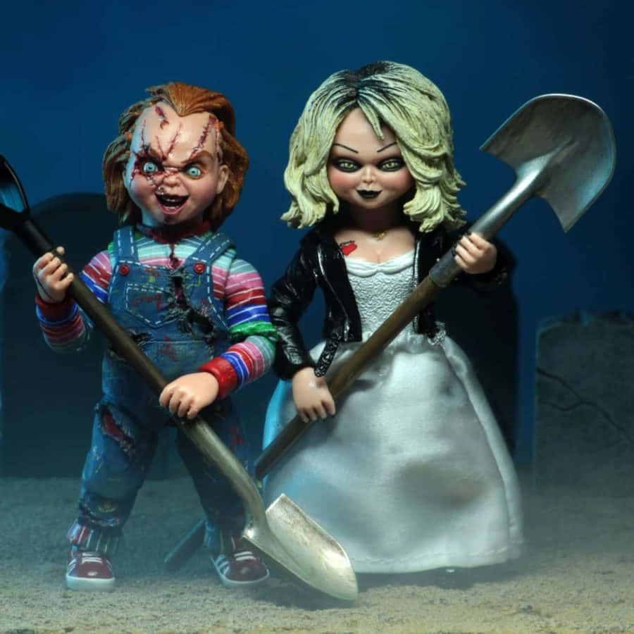 Brideand Chucky Dolls With Weapons Background