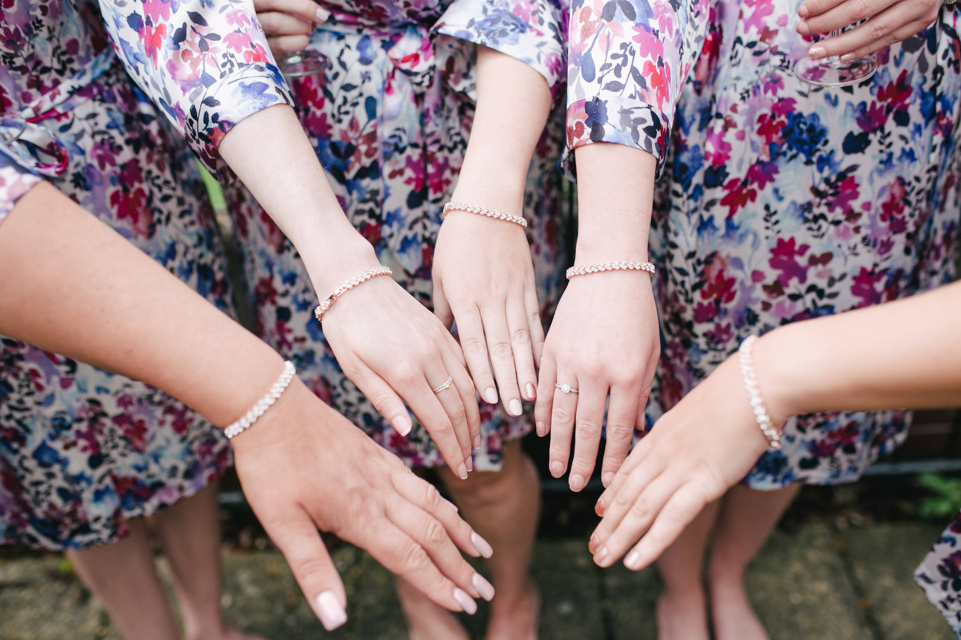 Bridesmaids Hands With Bracelets Background